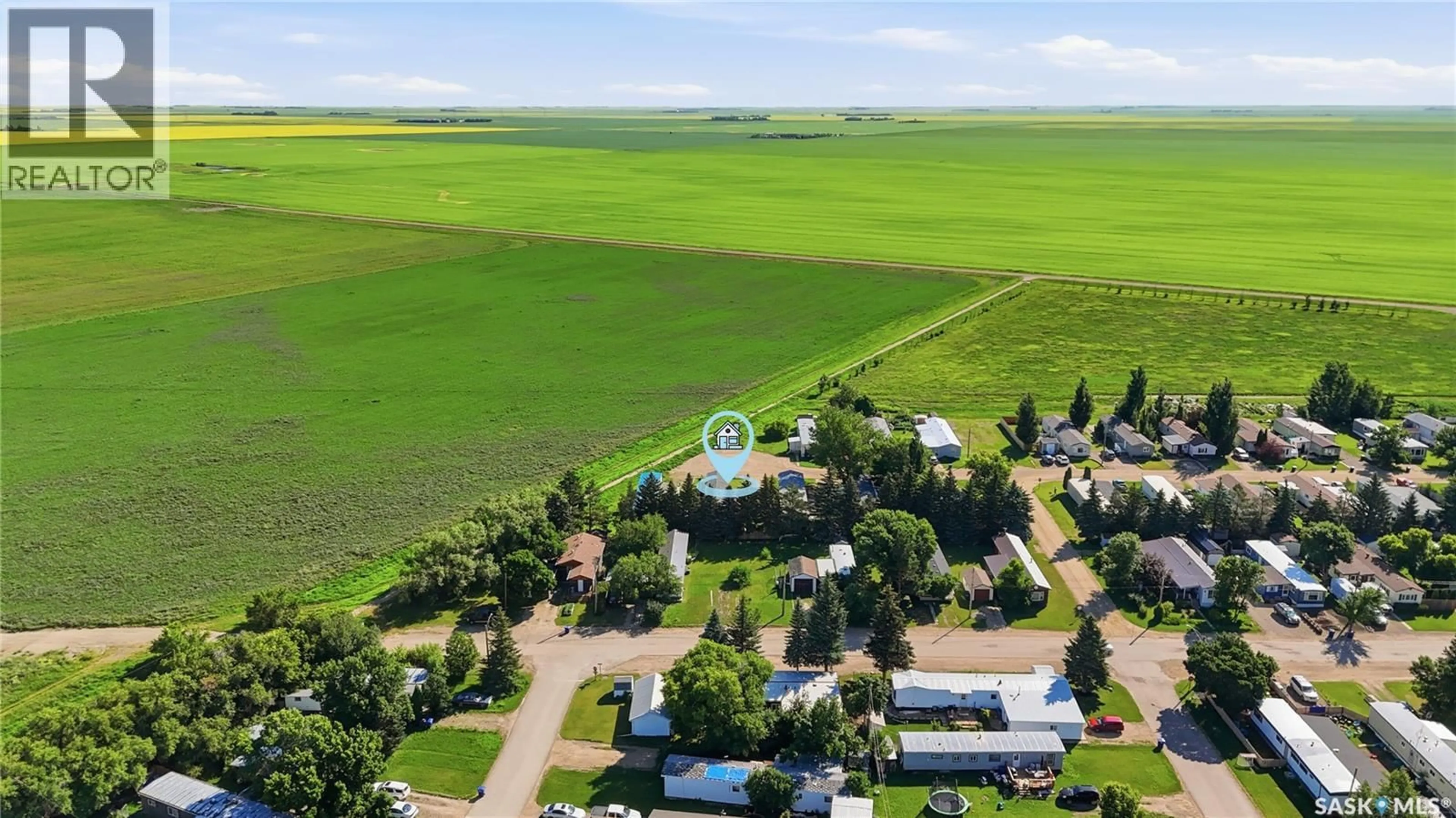 A pic from outside/outdoor area/front of a property/back of a property/a pic from drone, mountain view for 134 SPRUCE STREET, Caronport Saskatchewan S0H0S0