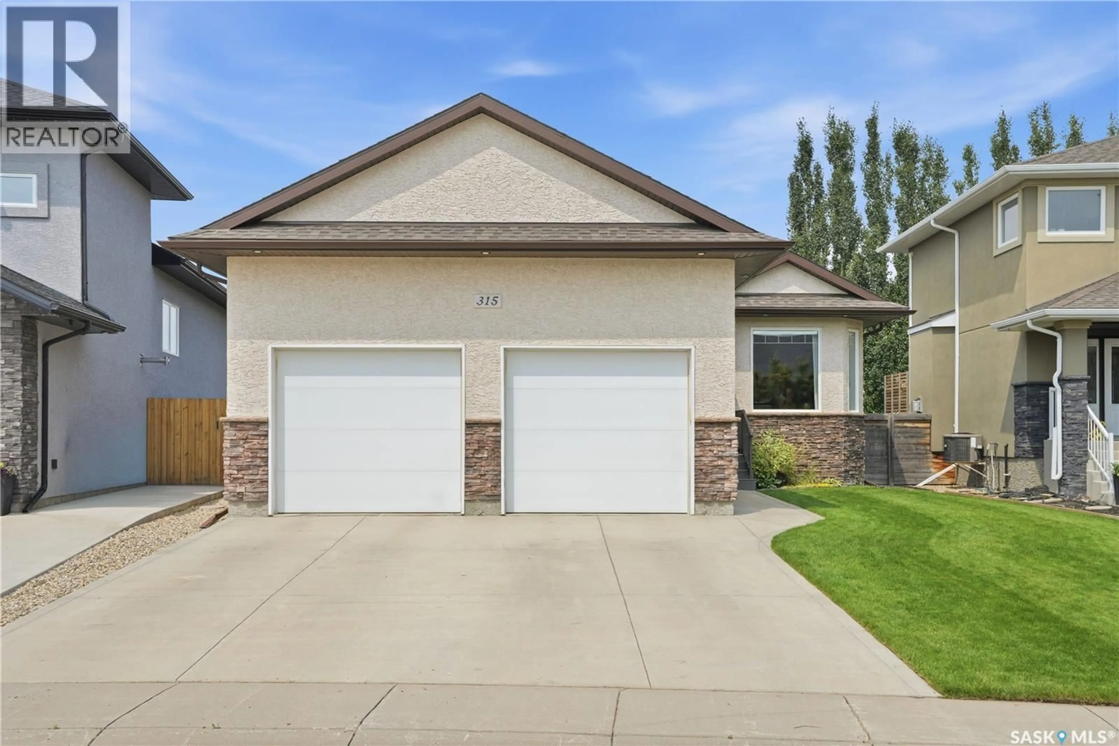 Home with vinyl exterior material, street for 315 WERSCHNER LANE, Saskatoon Saskatchewan S7V0C9