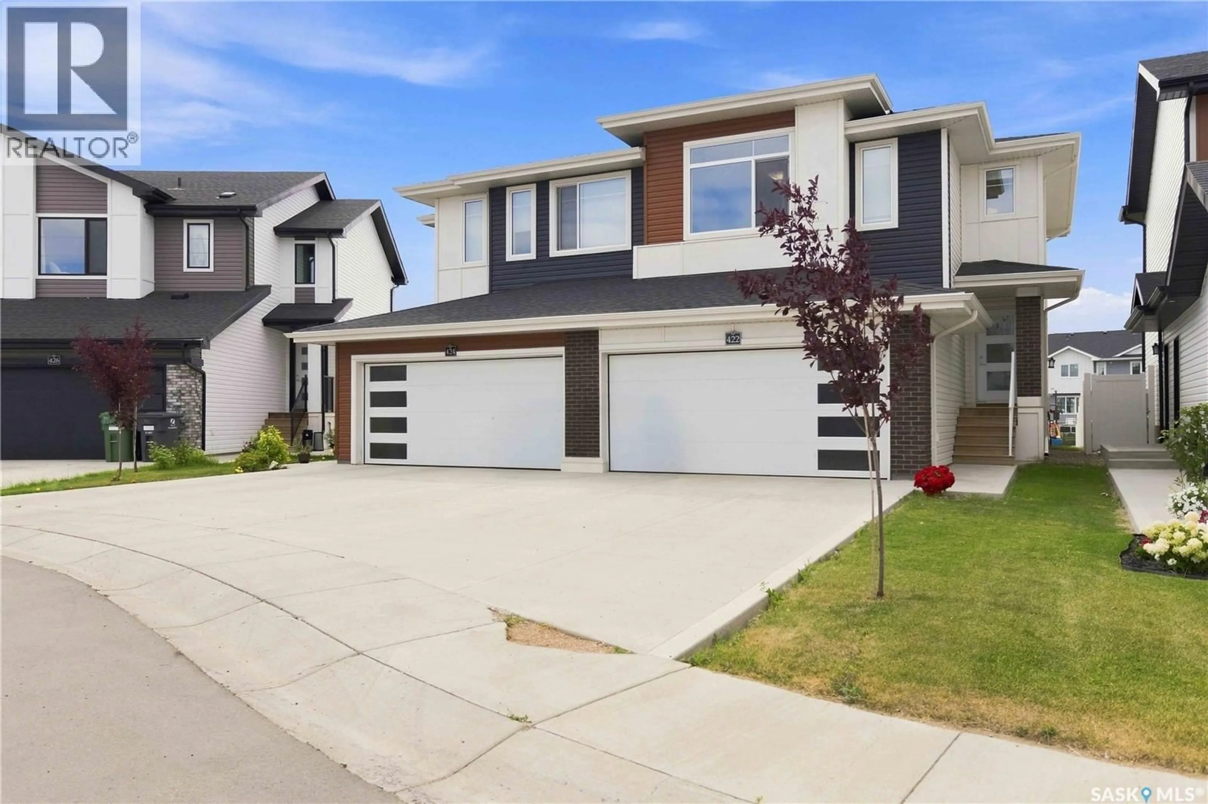 Home with vinyl exterior material, street for 422 MYLES HEIDT MANOR, Saskatoon Saskatchewan S7W1J1