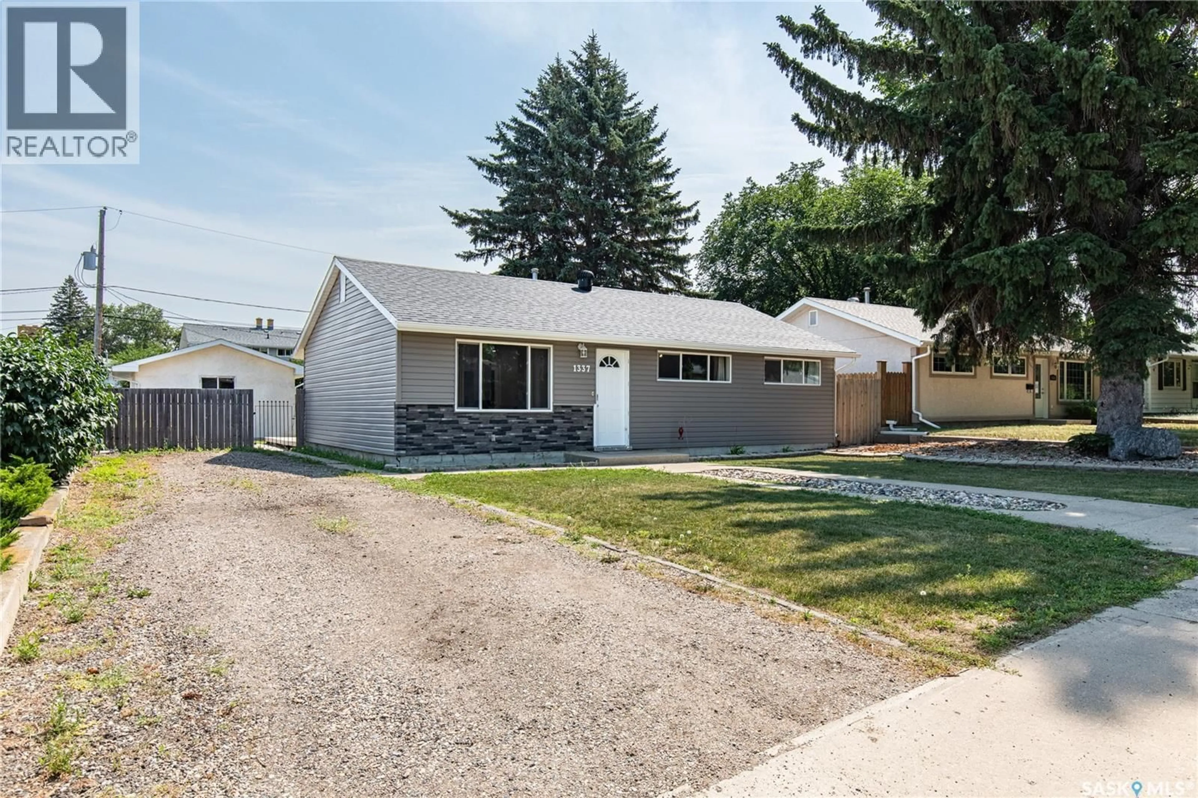 Home with vinyl exterior material, street for 1337 7TH AVENUE, Moose Jaw Saskatchewan S6H4C8