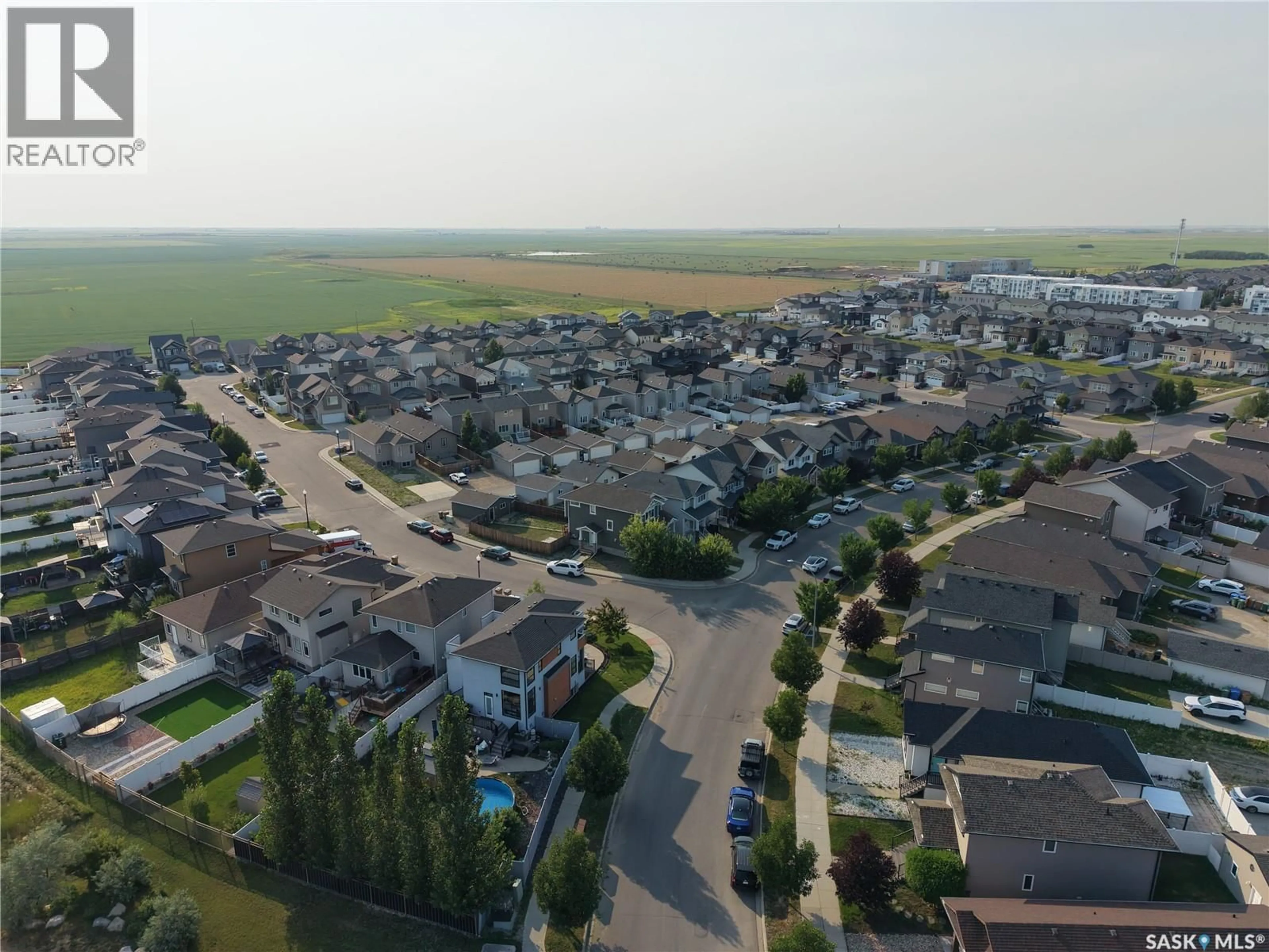 A pic from outside/outdoor area/front of a property/back of a property/a pic from drone, street for 4648 JAMES HILL ROAD, Regina Saskatchewan S4W0C7