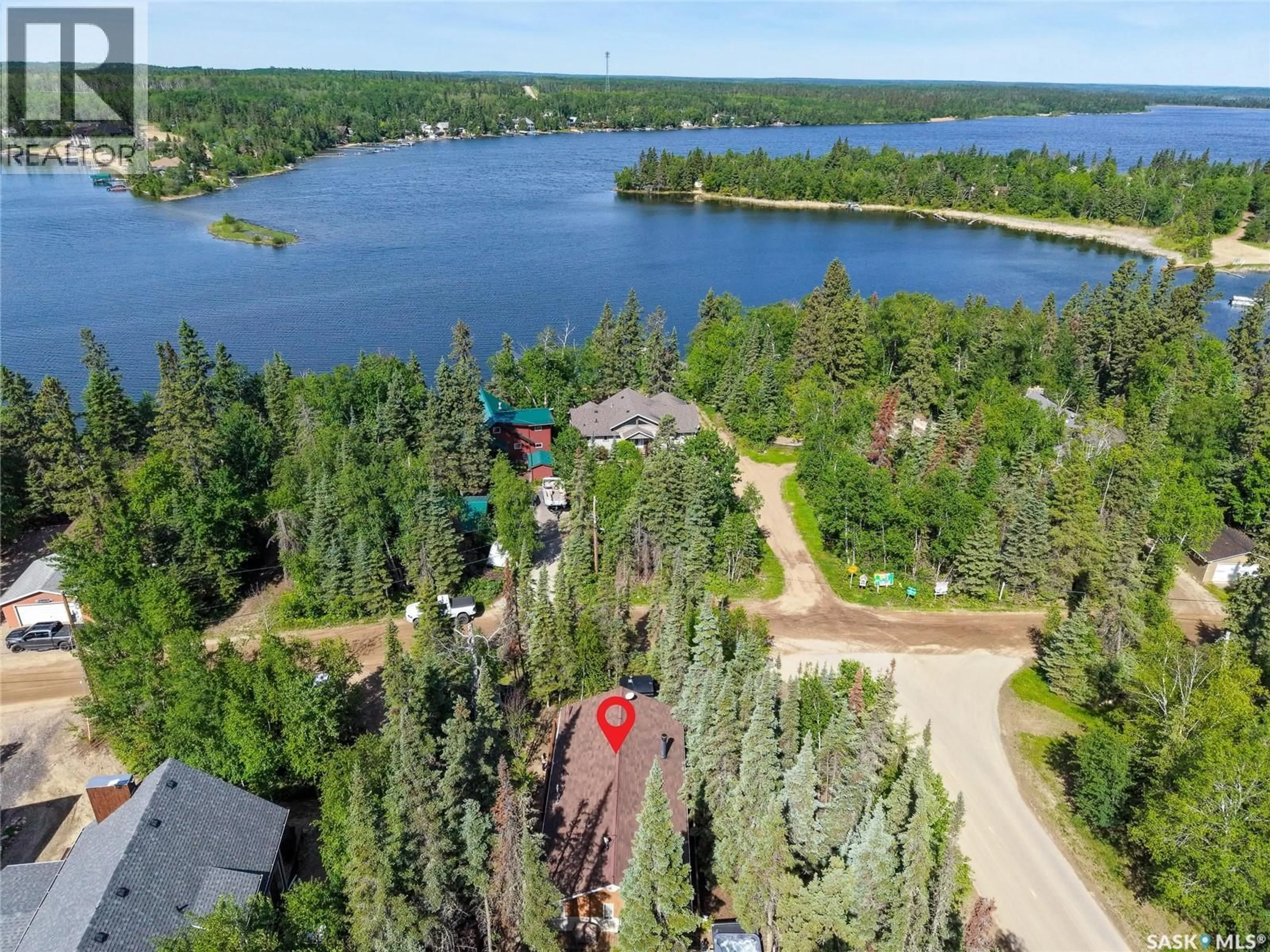 A pic from outside/outdoor area/front of a property/back of a property/a pic from drone, water/lake/river/ocean view for 619 MARINE DRIVE, Emma Lake Saskatchewan S0J0N0