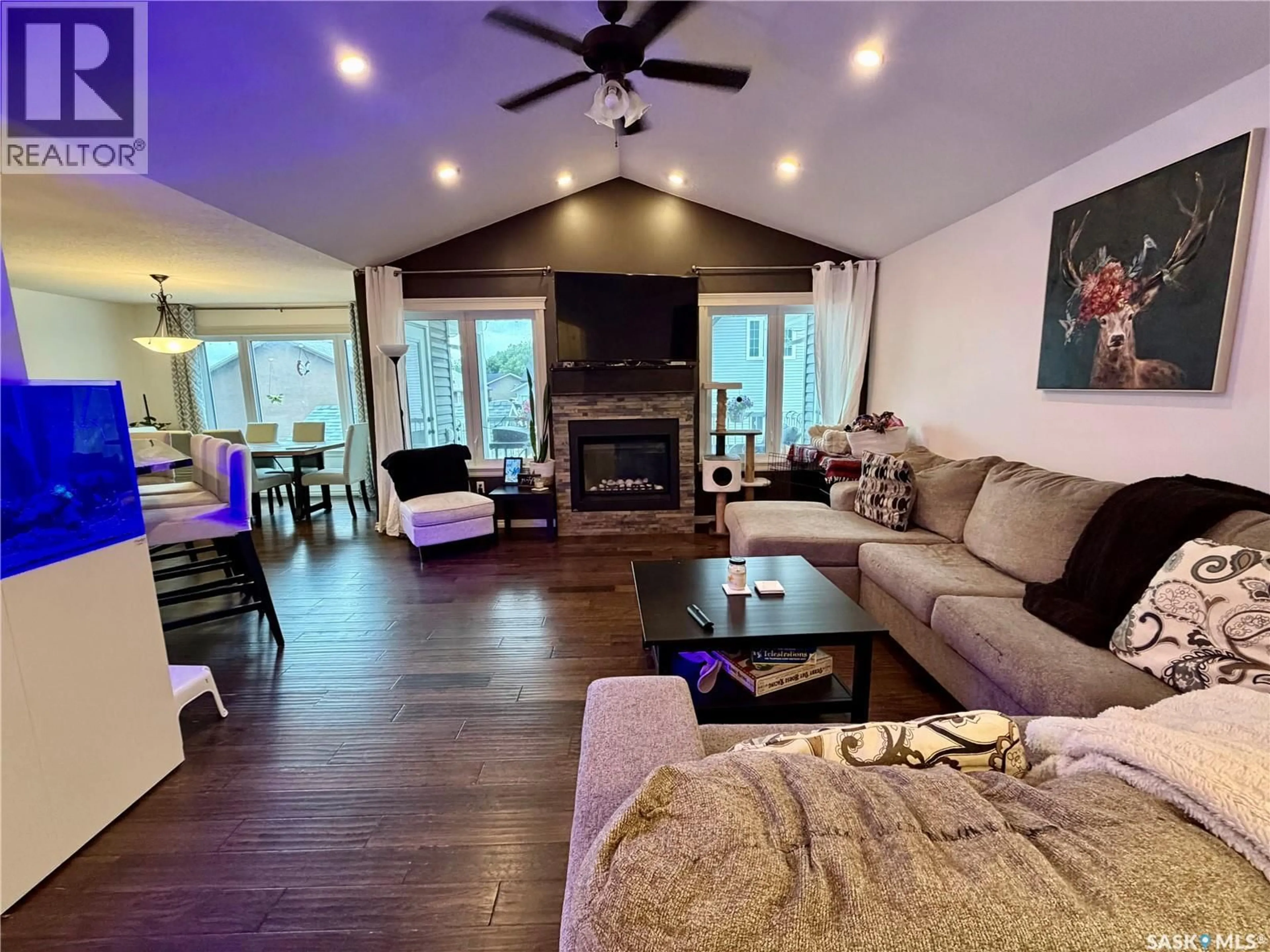Living room with furniture, wood/laminate floor for 504 WRIGHT ROAD, Moosomin Saskatchewan S0G3N0