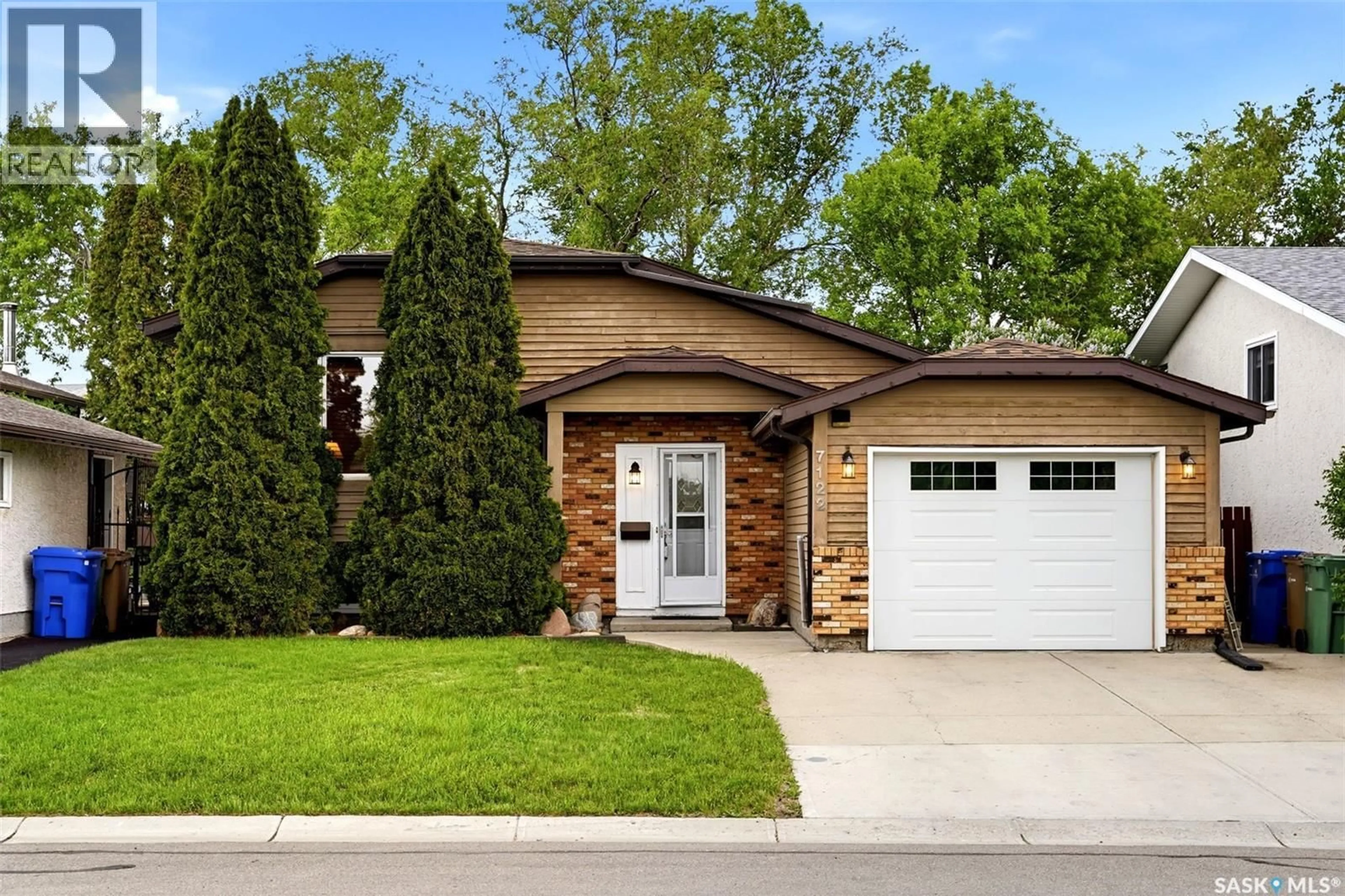 Home with brick exterior material, street for 7122 LAWRENCE DRIVE, Regina Saskatchewan S4X3X6