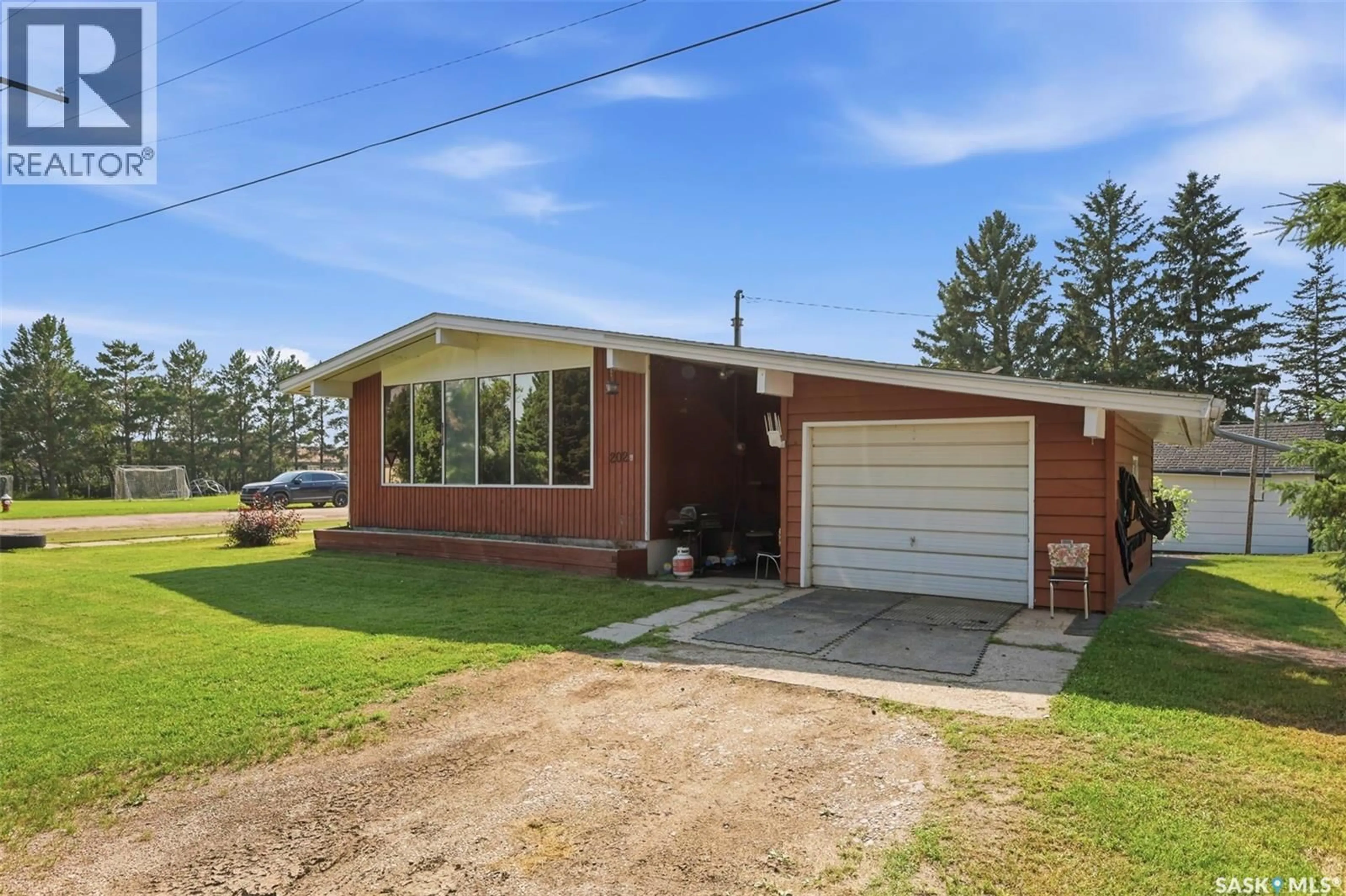 Home with brick exterior material, street for 202 PRINCESS AVENUE, Hafford Saskatchewan S0J1A0