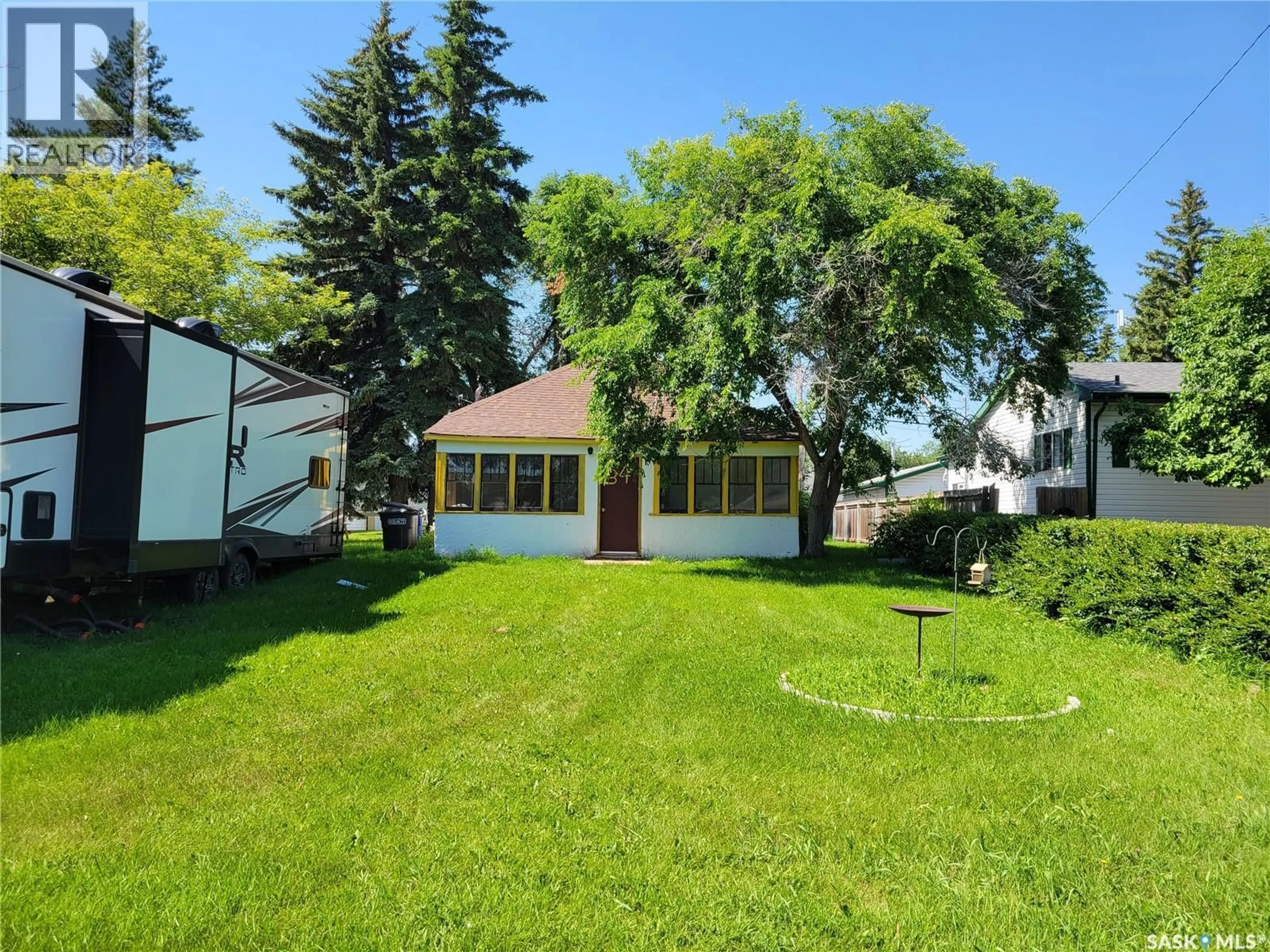A pic from outside/outdoor area/front of a property/back of a property/a pic from drone, street for 34 BANTRY STREET, Lanigan Saskatchewan S0K2M0