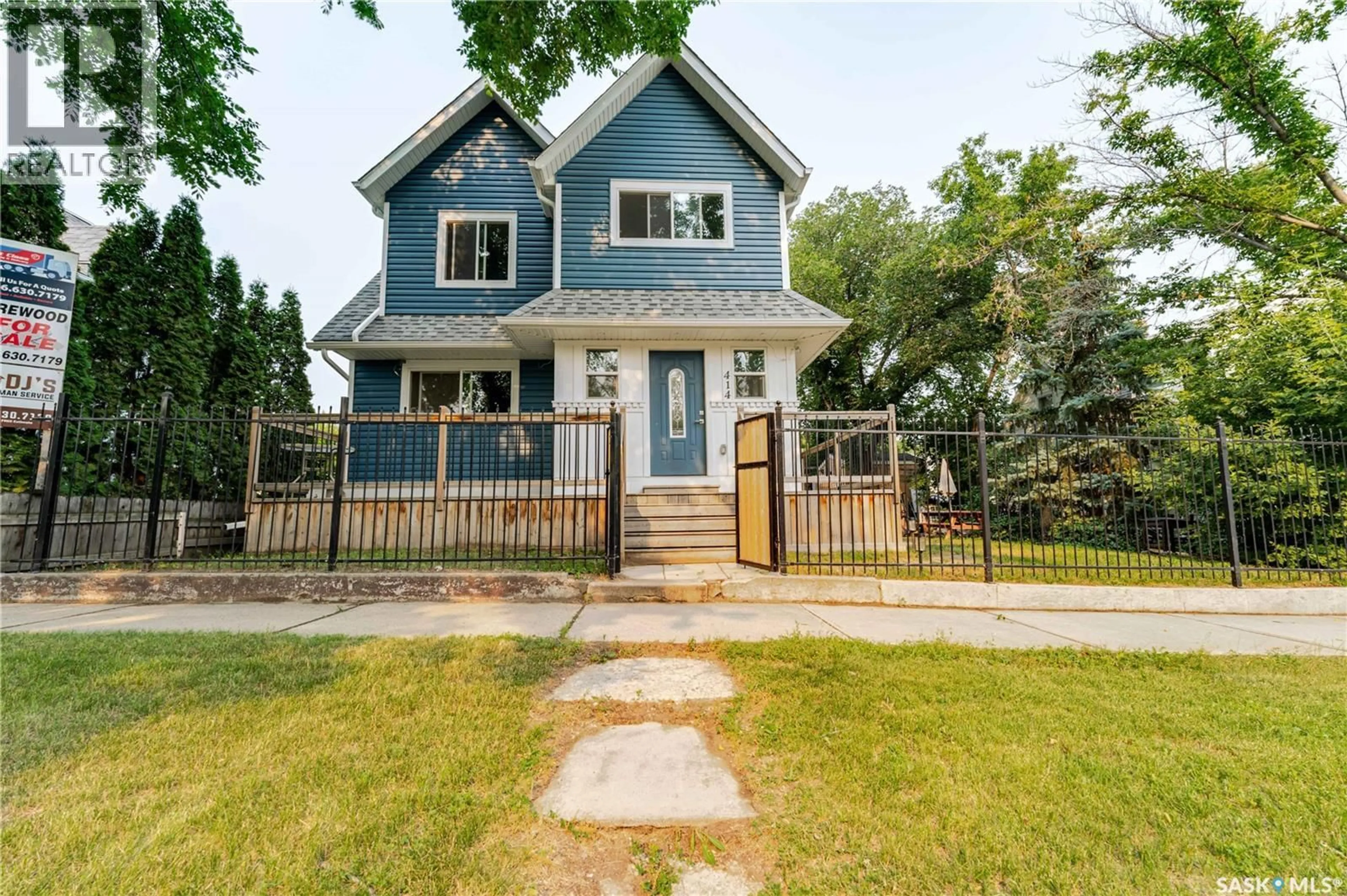 Home with vinyl exterior material, street for 414 MAIN STREET, Moose Jaw Saskatchewan S6H5S9