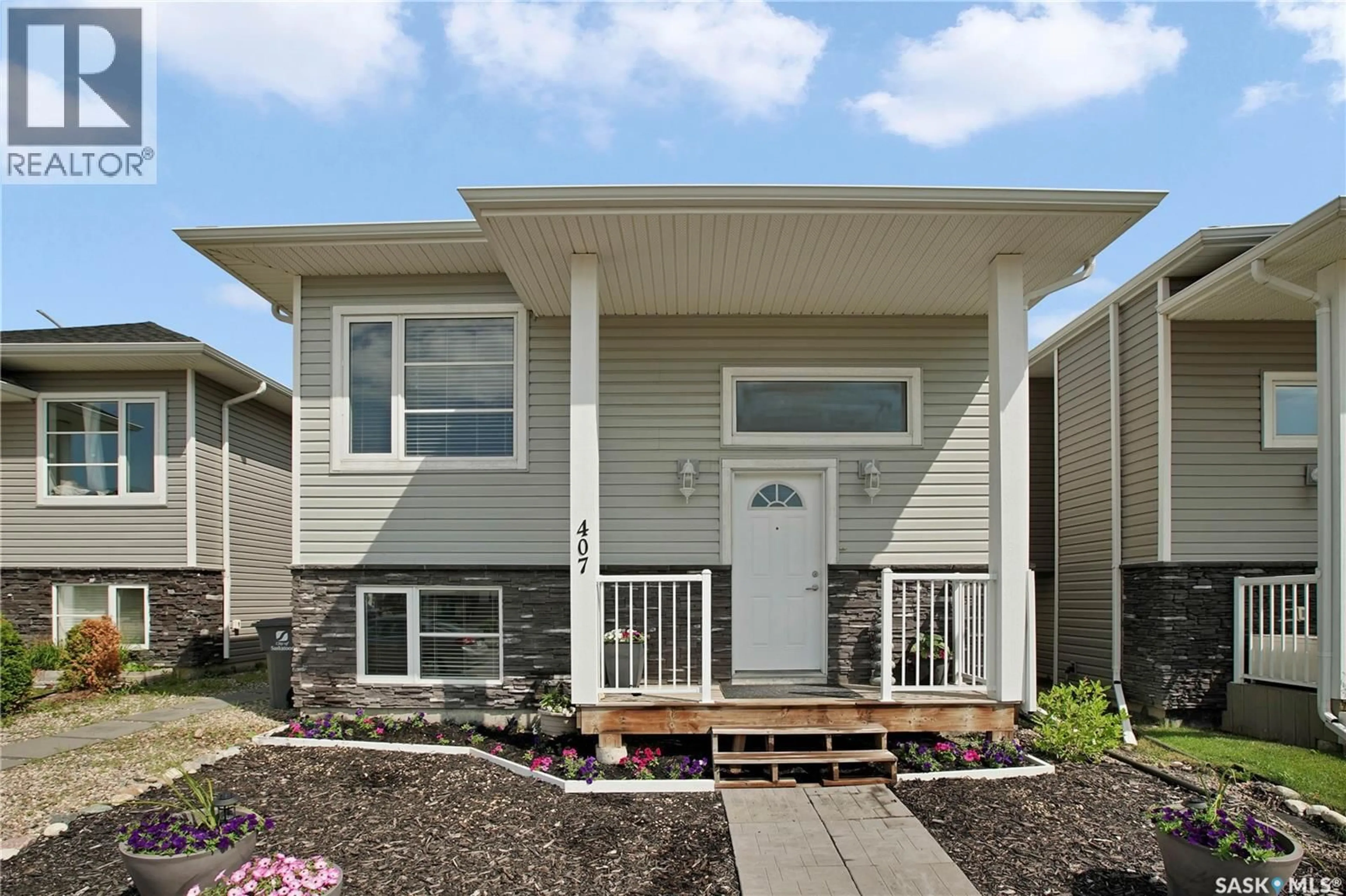 Home with vinyl exterior material, street for 407 BOYKOWICH STREET, Saskatoon Saskatchewan S7W0S5