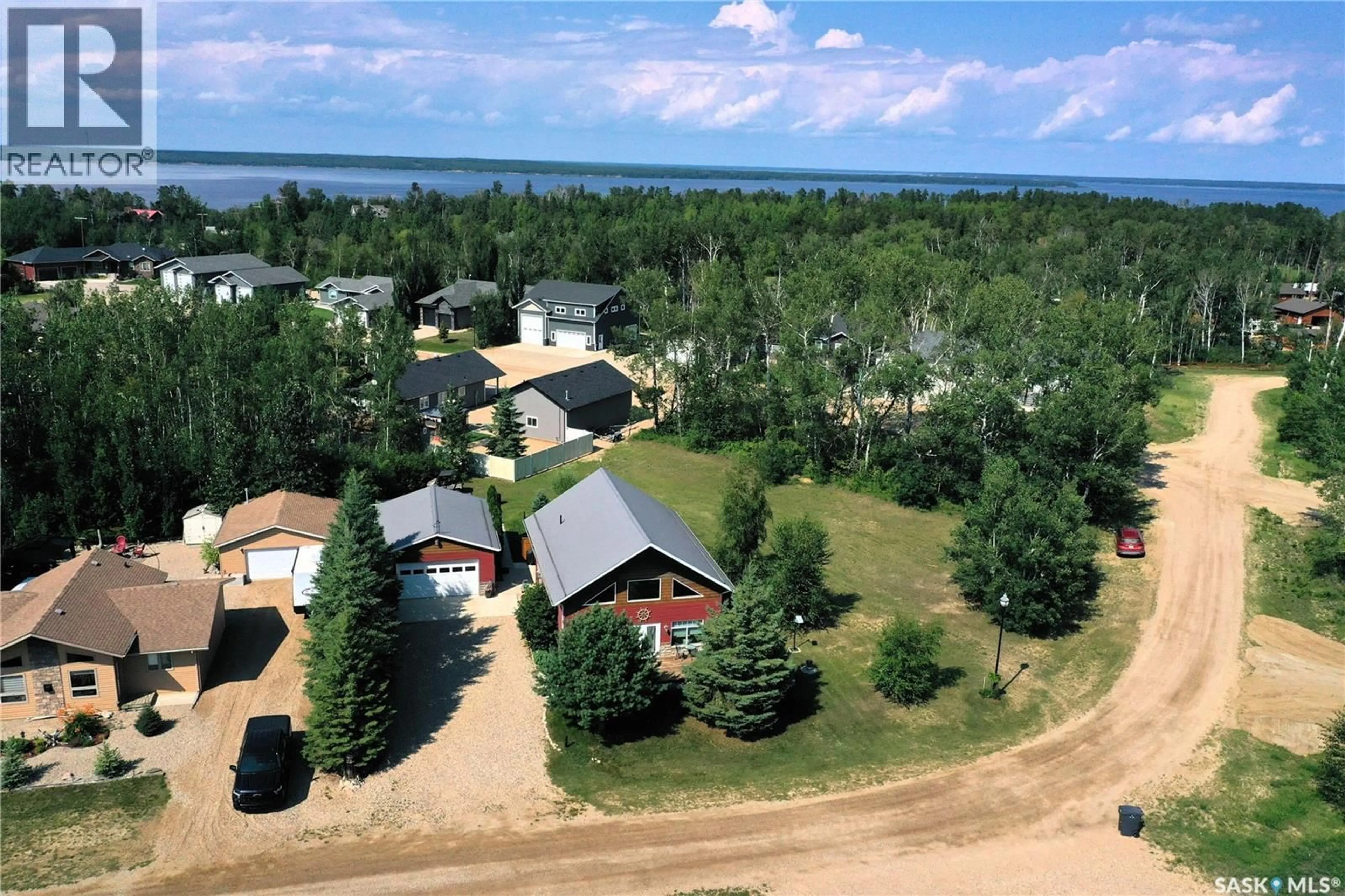 A pic from outside/outdoor area/front of a property/back of a property/a pic from drone, water/lake/river/ocean view for 308 PARK DRIVE, Tobin Lake Saskatchewan S0E1E0