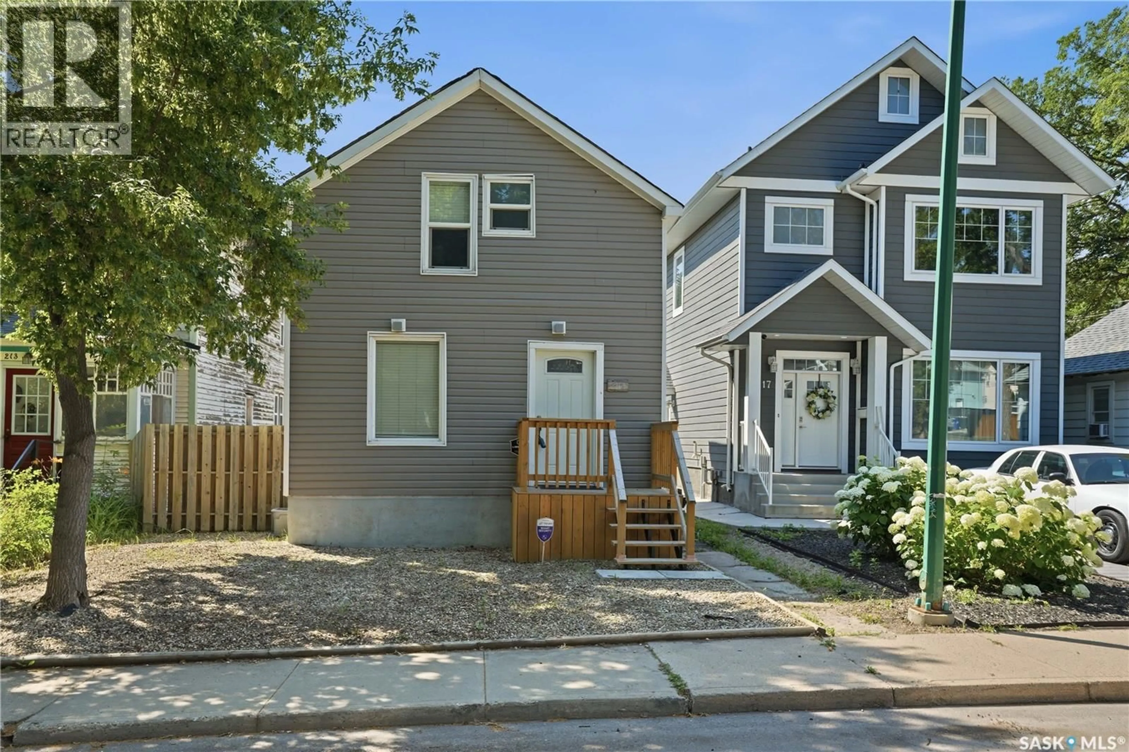 Home with vinyl exterior material, street for 215 26TH STREET, Saskatoon Saskatchewan S7L0C3
