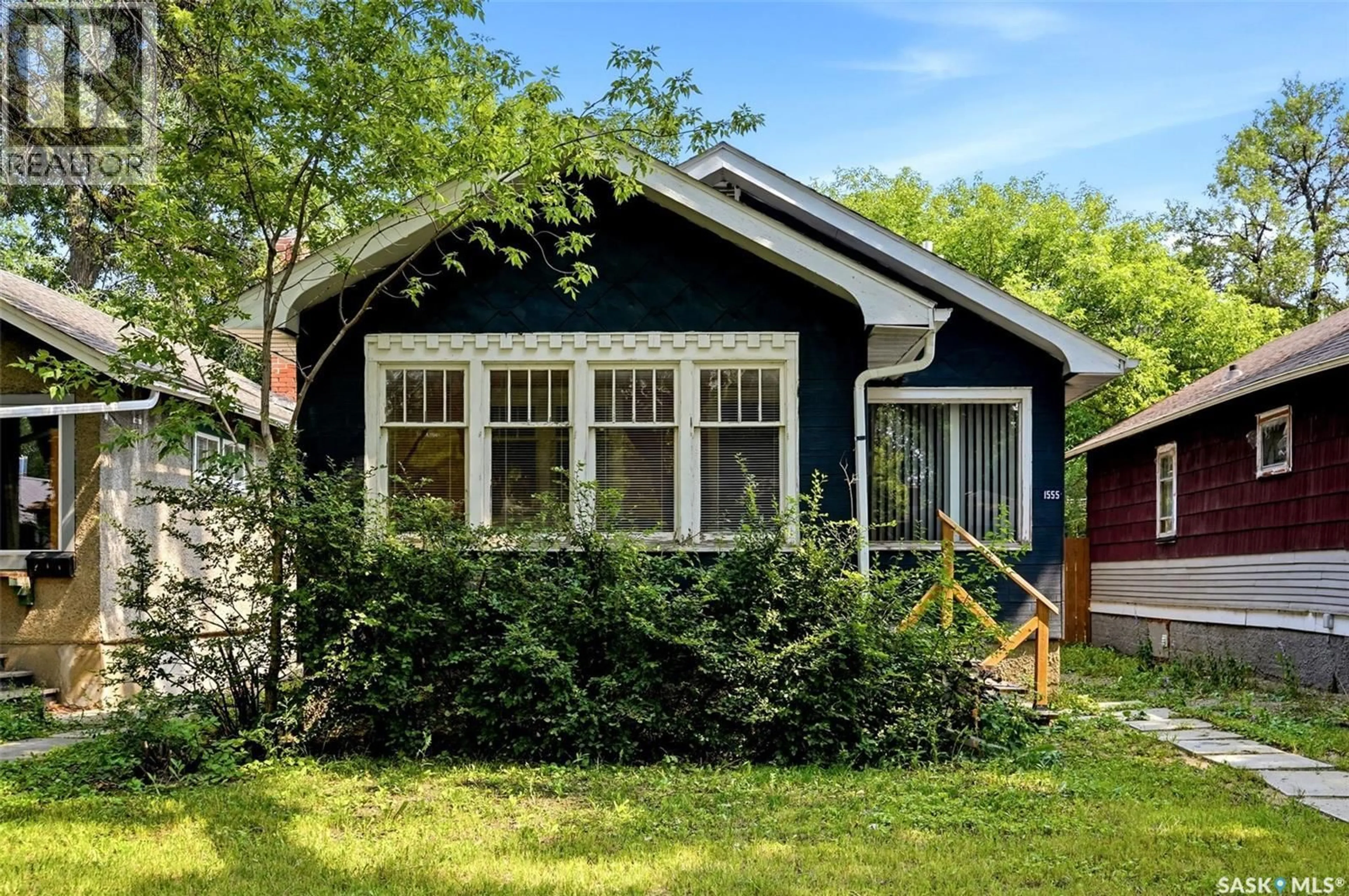 Home with vinyl exterior material, street for 1555 RETALLACK STREET, Regina Saskatchewan S4N2J5