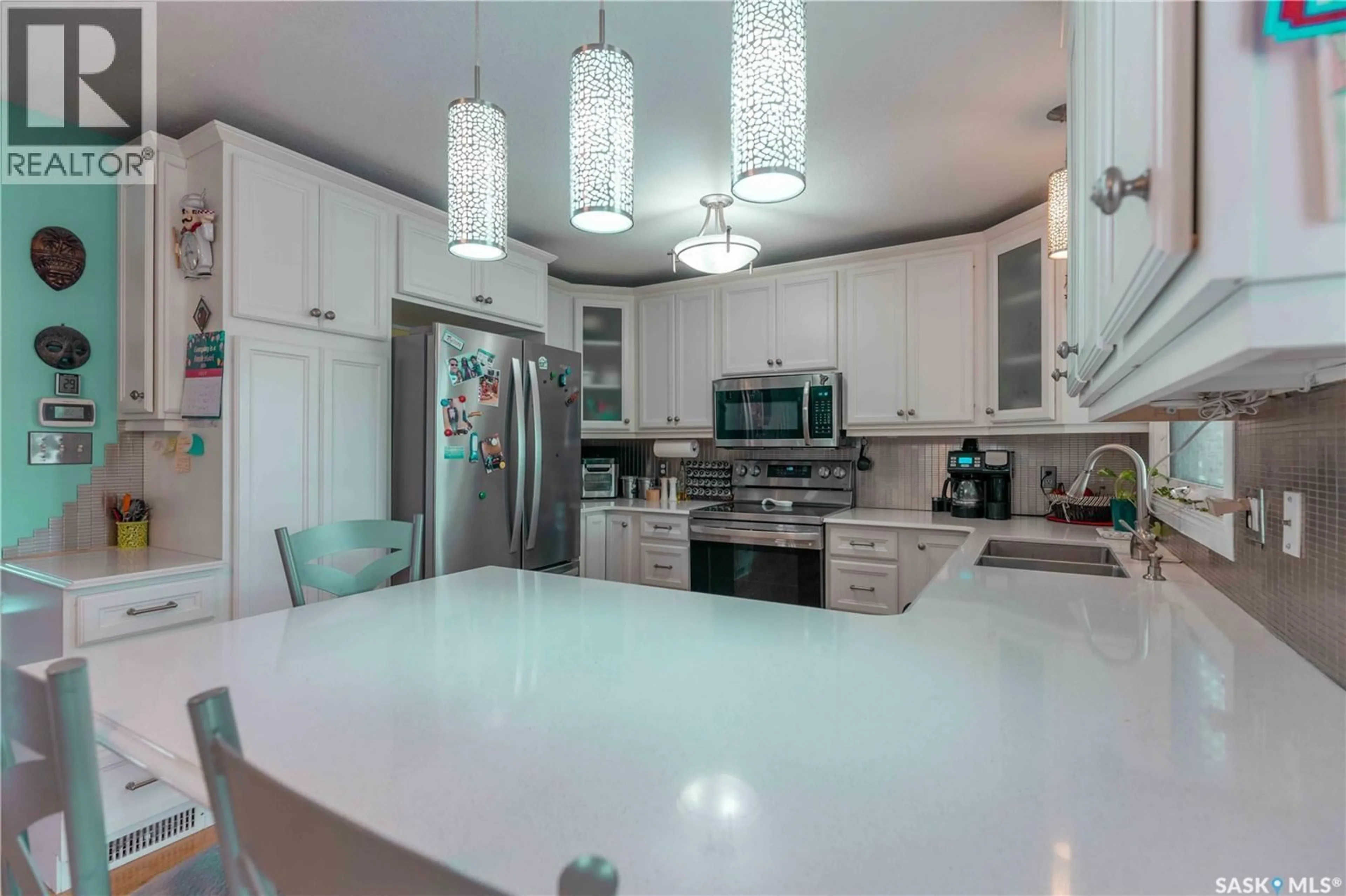 Open concept kitchen, ceramic/tile floor for 50 MANITOU COURT, Saskatoon Saskatchewan S7K5G3
