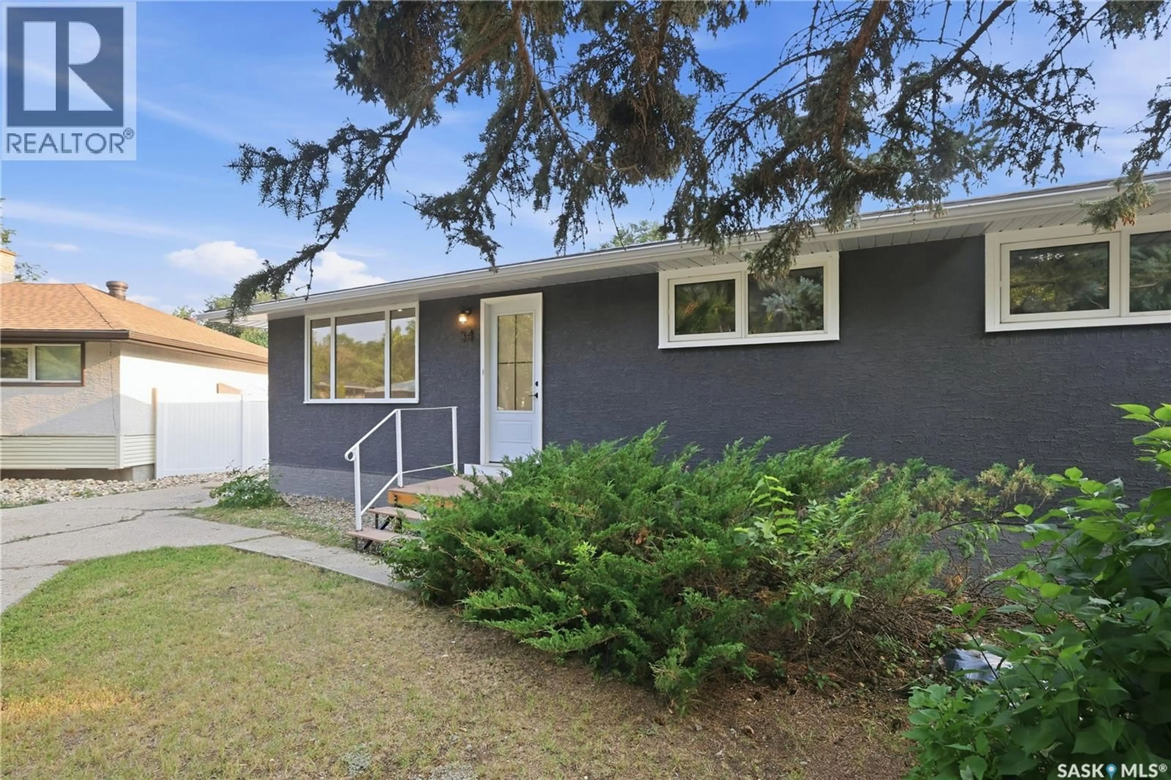 Home with vinyl exterior material, street for 34 OTTAWA PLACE, Regina Saskatchewan S4R2V7
