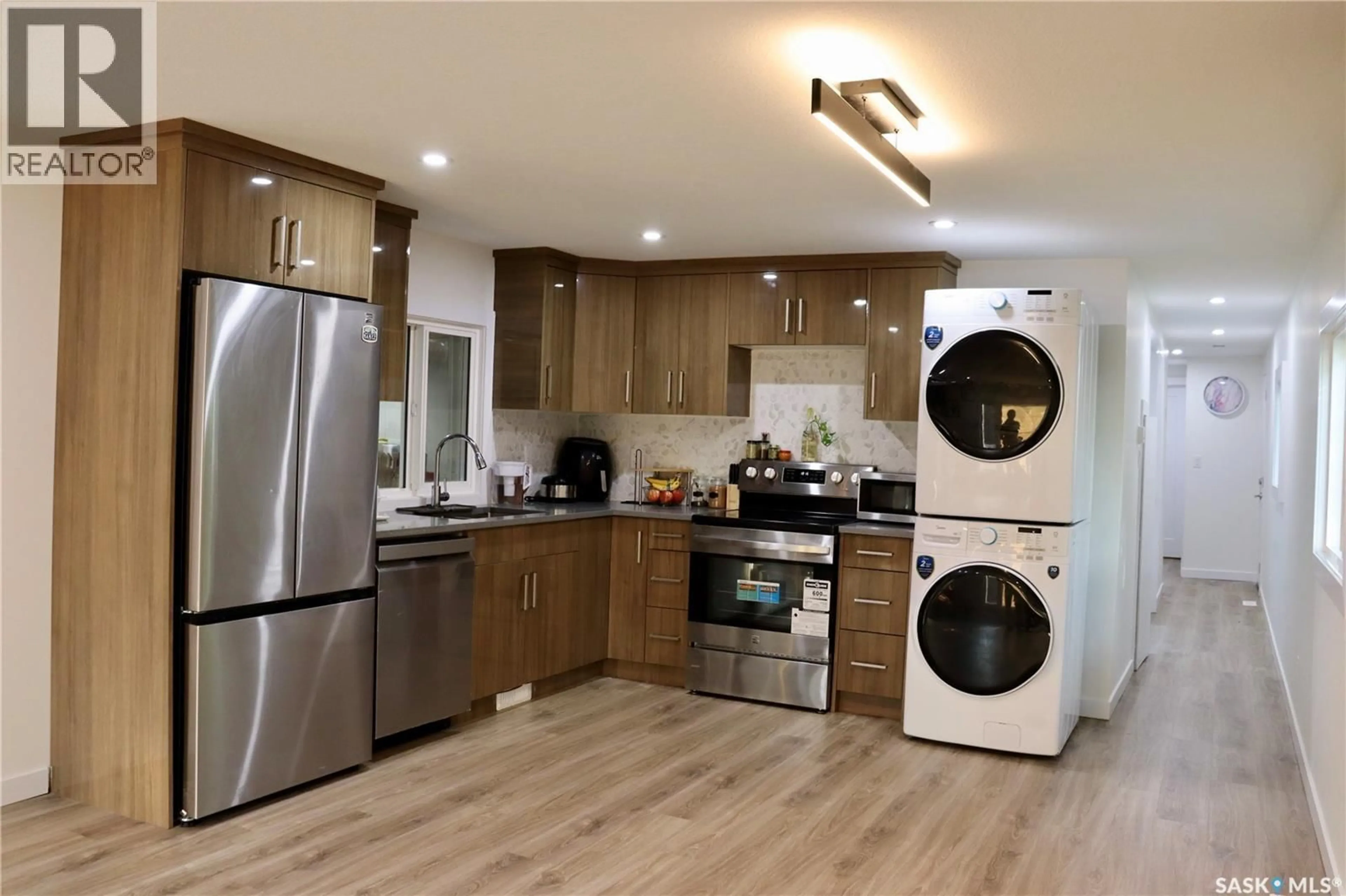 Open concept kitchen, wood/laminate floor for 60 1035 BOYCHUK DRIVE, Saskatoon Saskatchewan S7H5B2