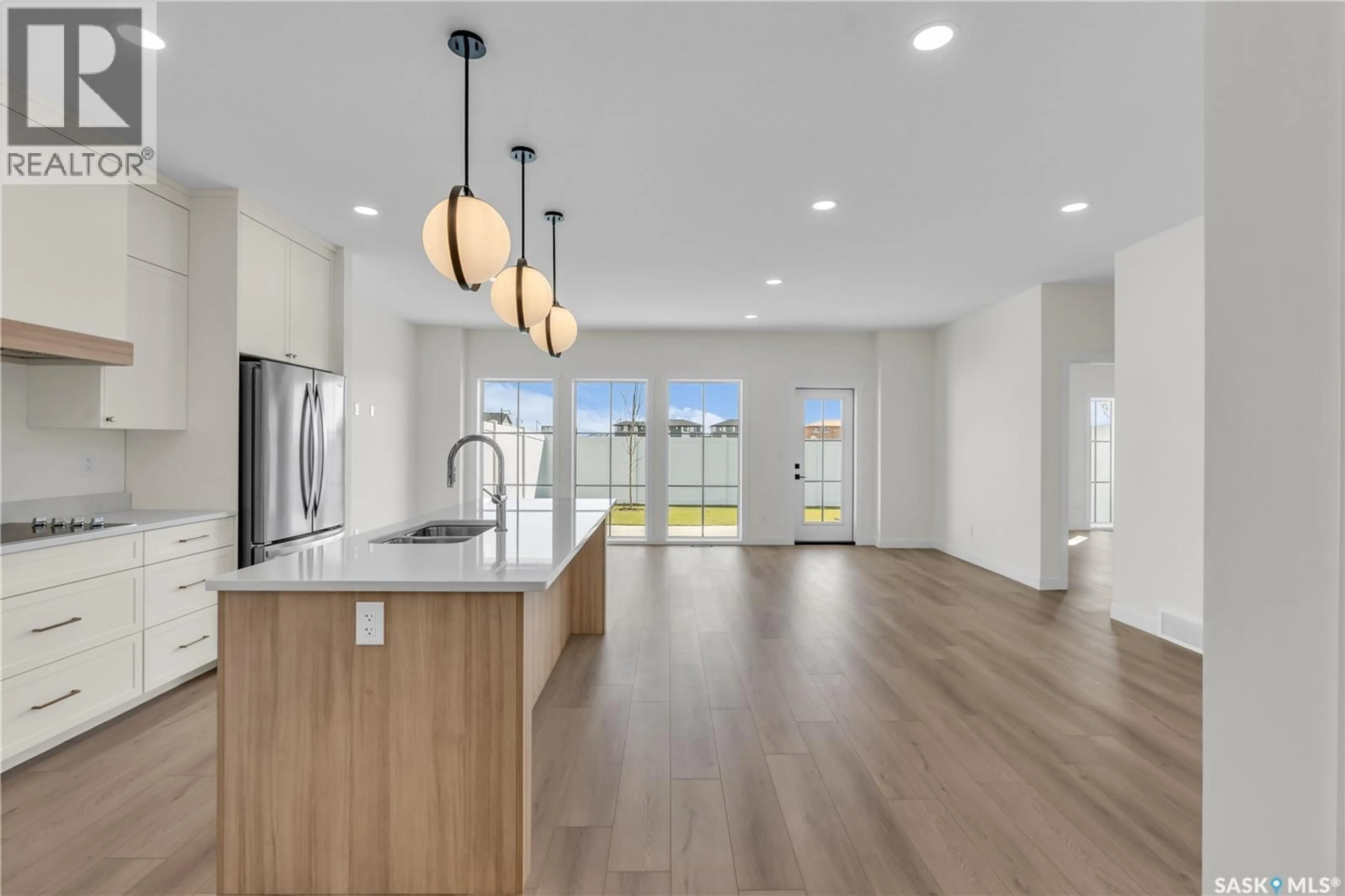 Open concept kitchen, ceramic/tile floor for 4 720 BRIGHTON BOULEVARD, Saskatoon Saskatchewan S7V1X1