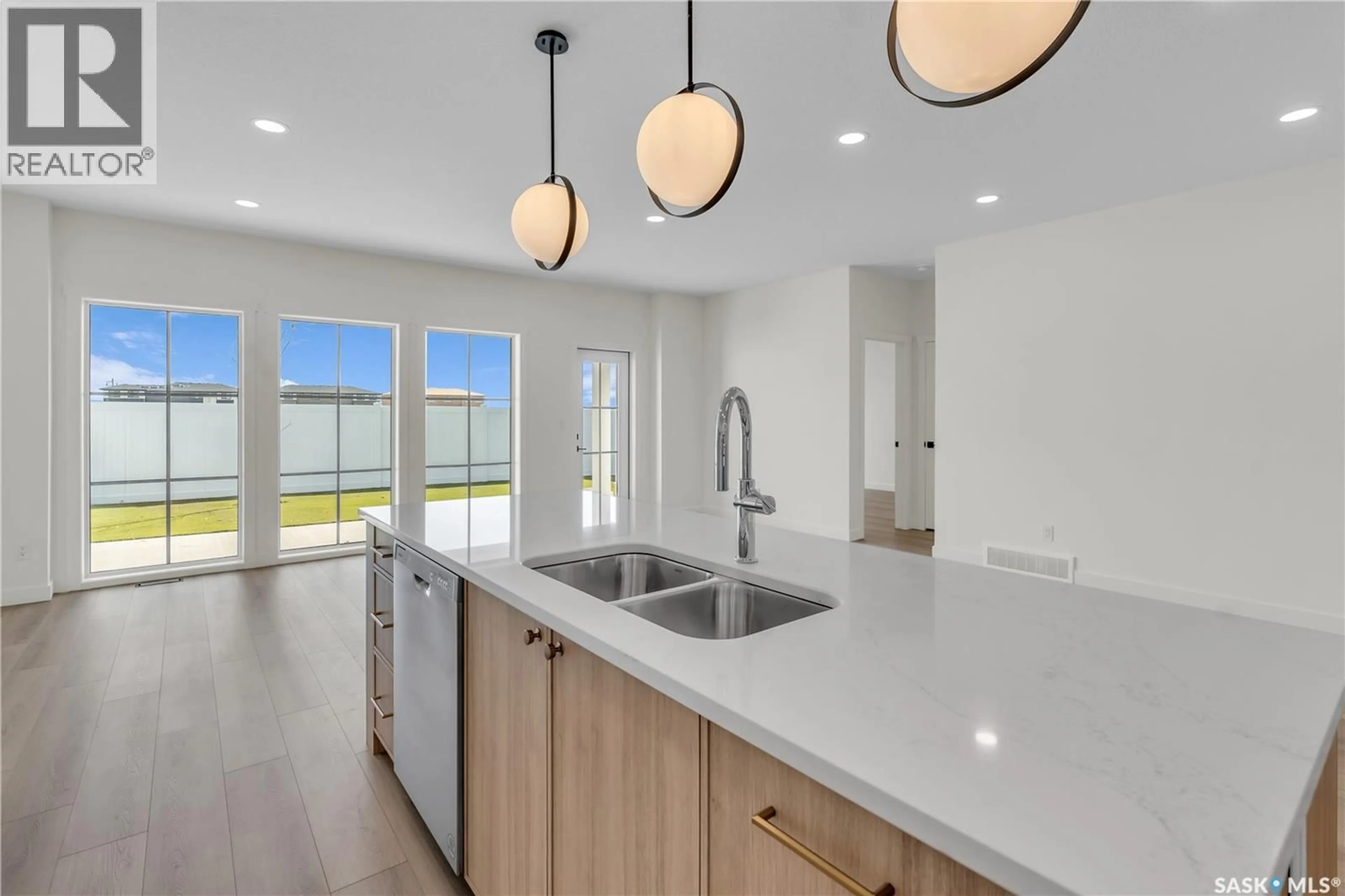 Open concept kitchen, ceramic/tile floor for 4 720 BRIGHTON BOULEVARD, Saskatoon Saskatchewan S7V1X1