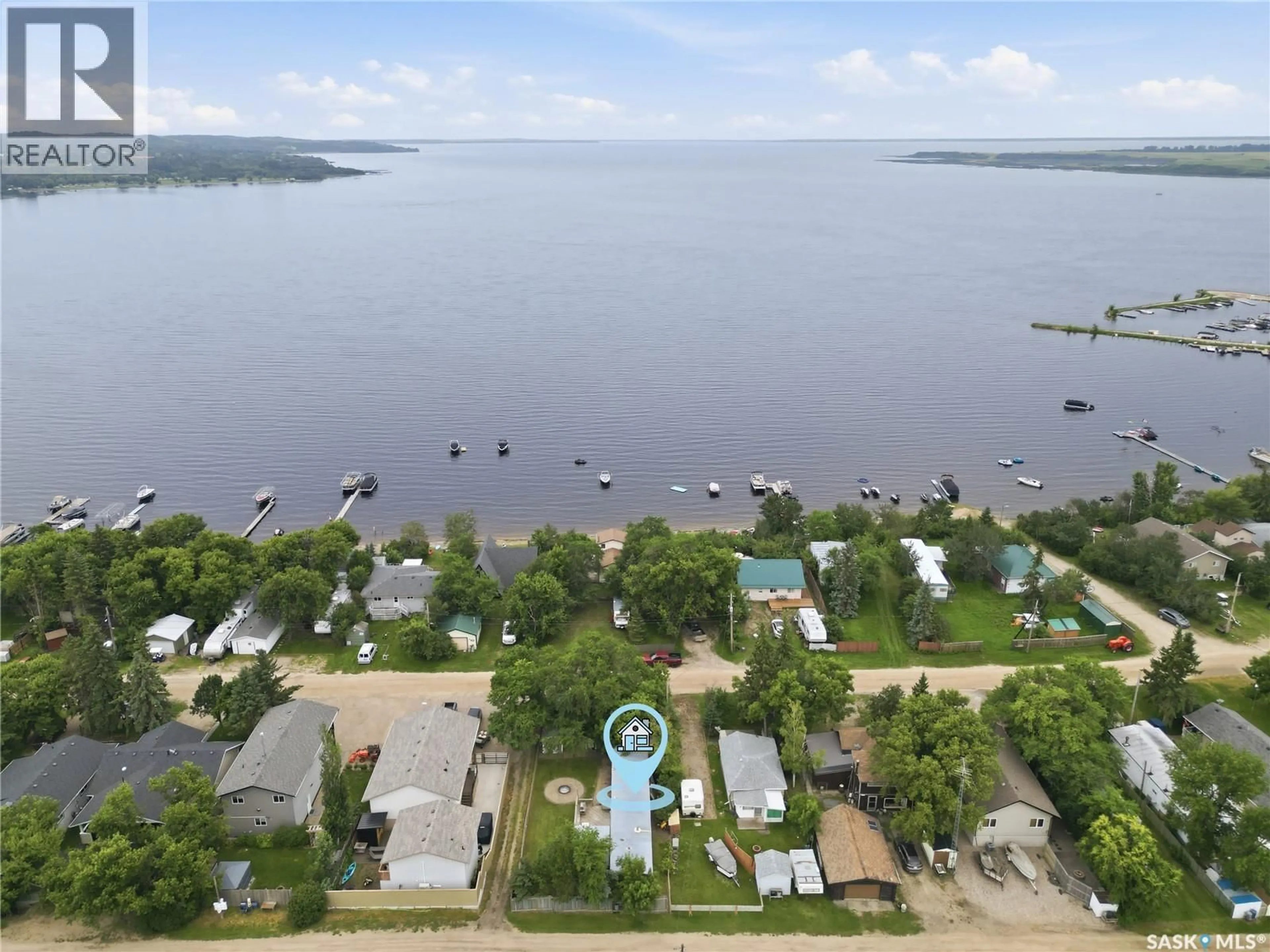 A pic from outside/outdoor area/front of a property/back of a property/a pic from drone, water/lake/river/ocean view for 461 POPLAR CRESCENT, Aquadeo Saskatchewan S0M1E0