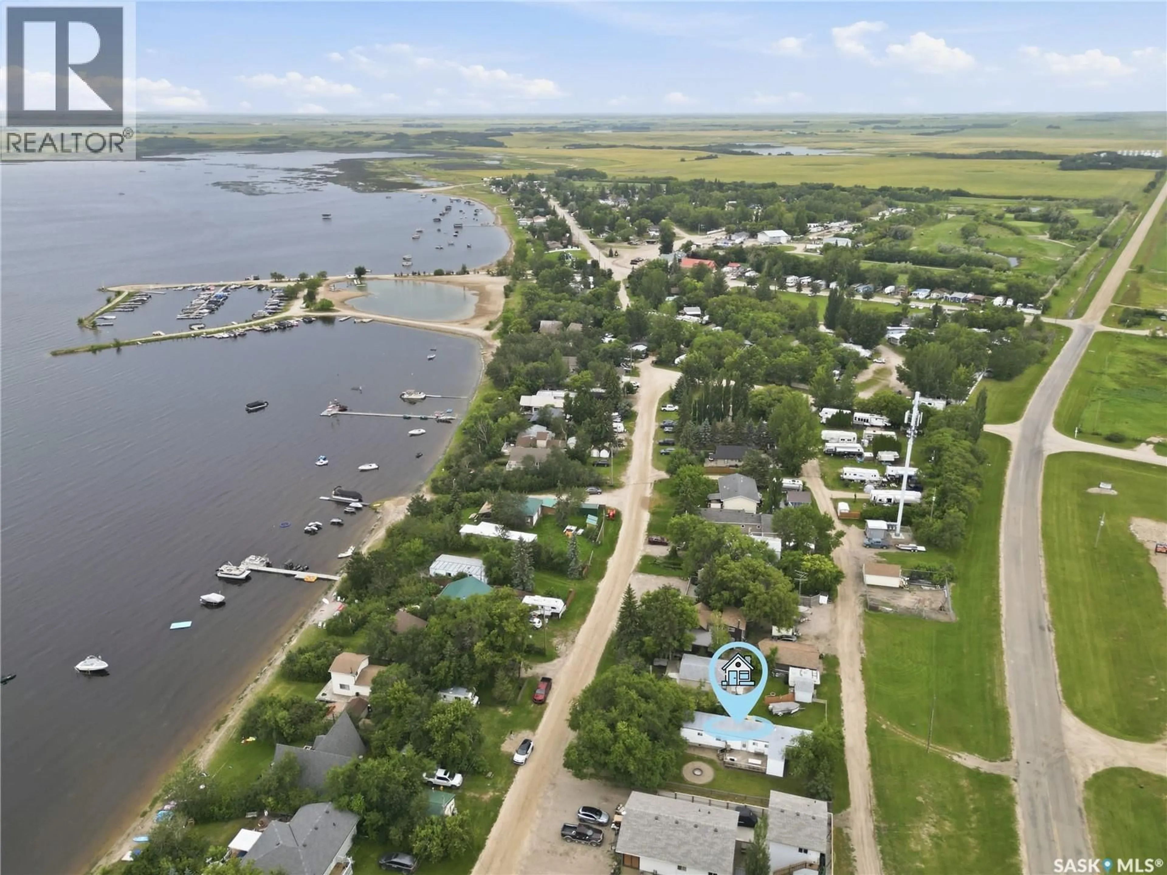A pic from outside/outdoor area/front of a property/back of a property/a pic from drone, water/lake/river/ocean view for 461 POPLAR CRESCENT, Aquadeo Saskatchewan S0M1E0