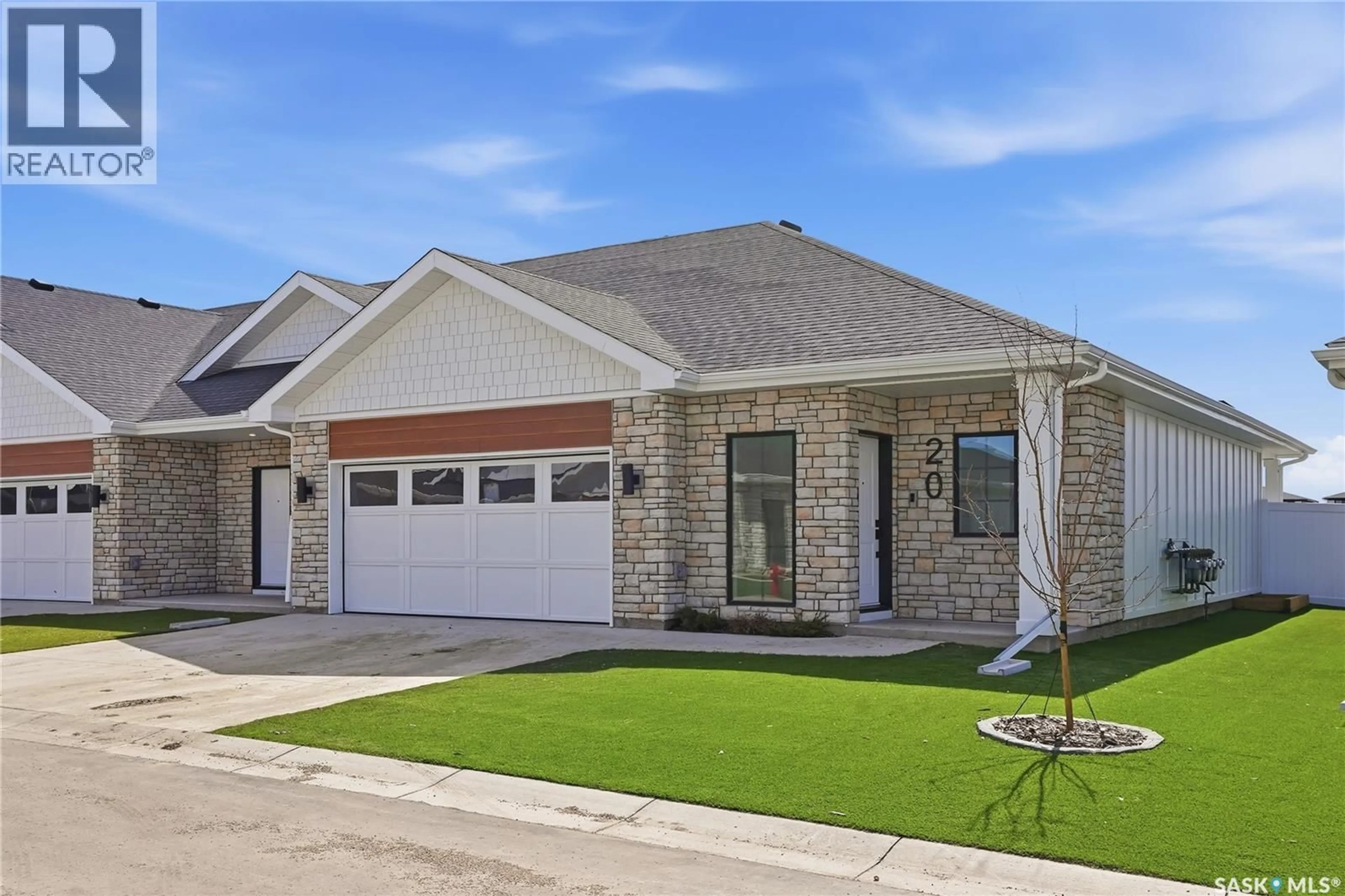 Home with brick exterior material, street for 20 BRIGHTON BOULEVARD, Saskatoon Saskatchewan S7V1X1