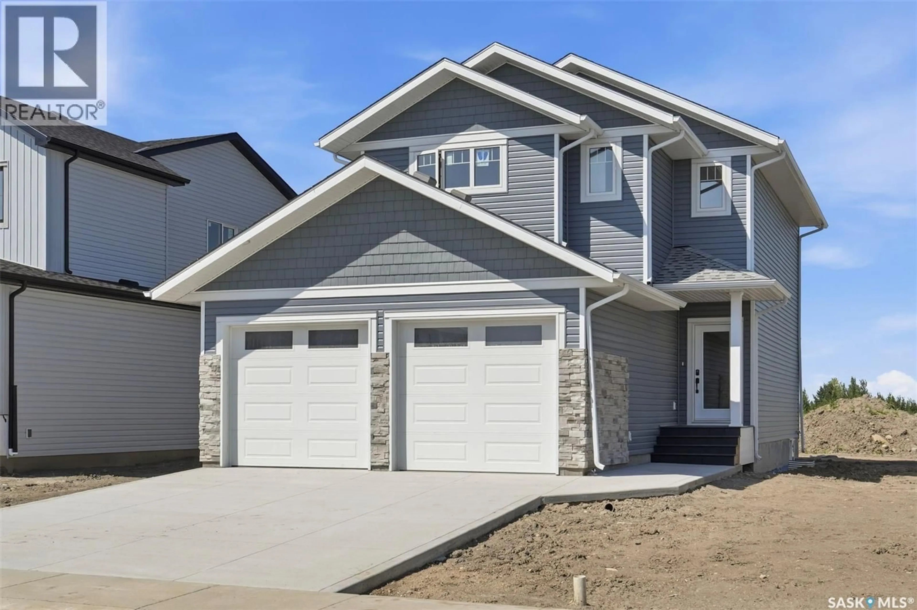 Home with vinyl exterior material, street for 145 EMMA CRESCENT, Martensville Saskatchewan S0K2T0