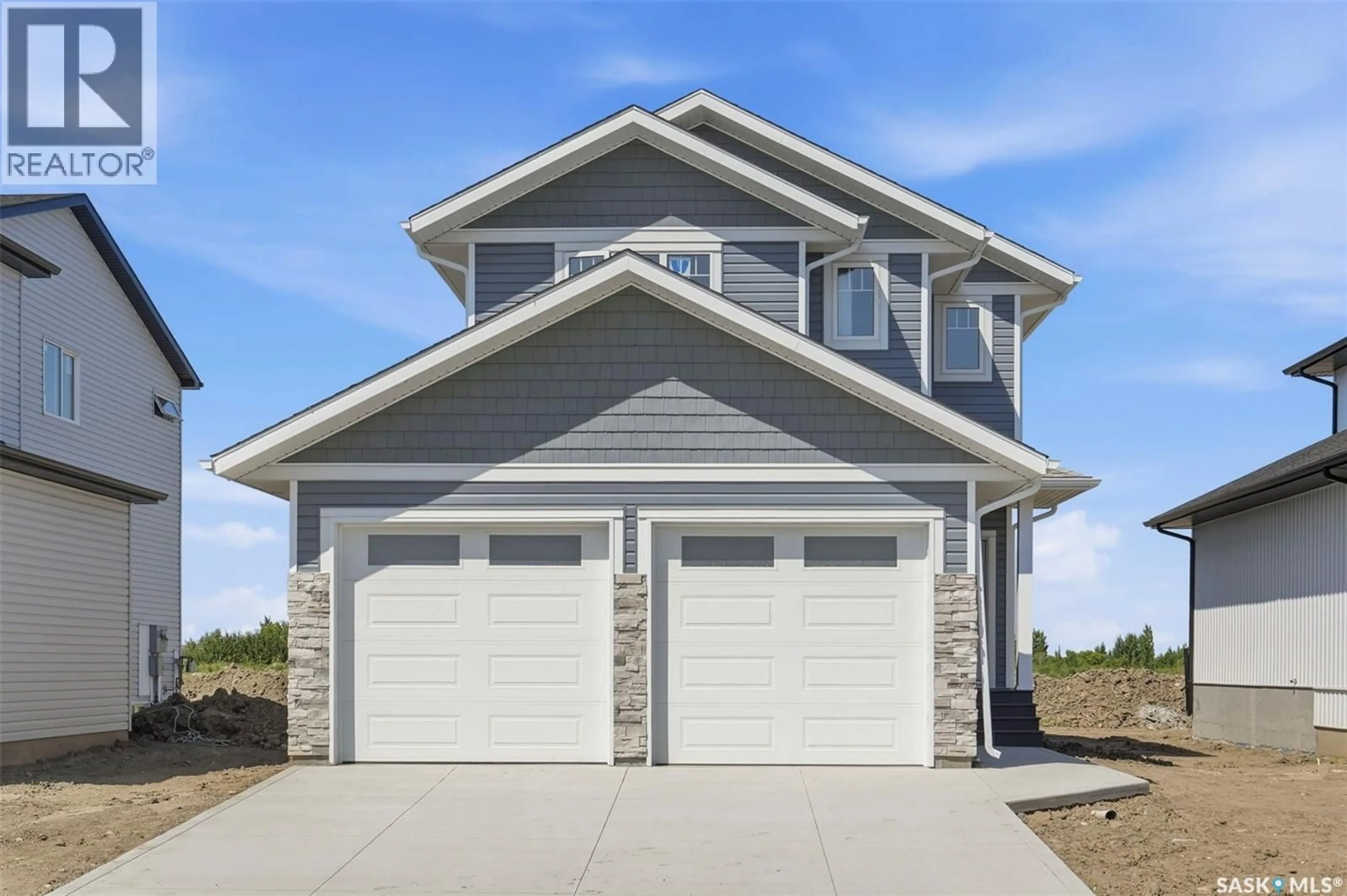 Home with vinyl exterior material, street for 145 EMMA CRESCENT, Martensville Saskatchewan S0K2T0
