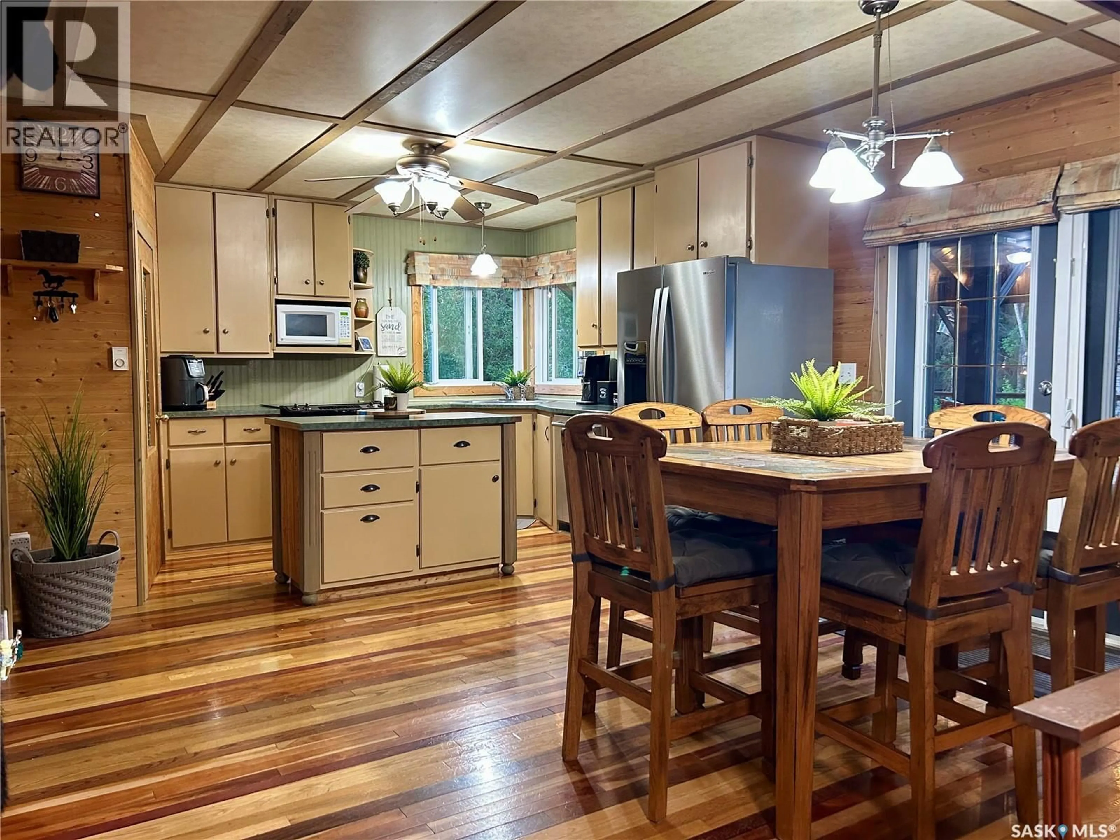Open concept kitchen, wood/laminate floor for 1306 KEWATIN LANE, Turtle Lake Saskatchewan S0M1J0