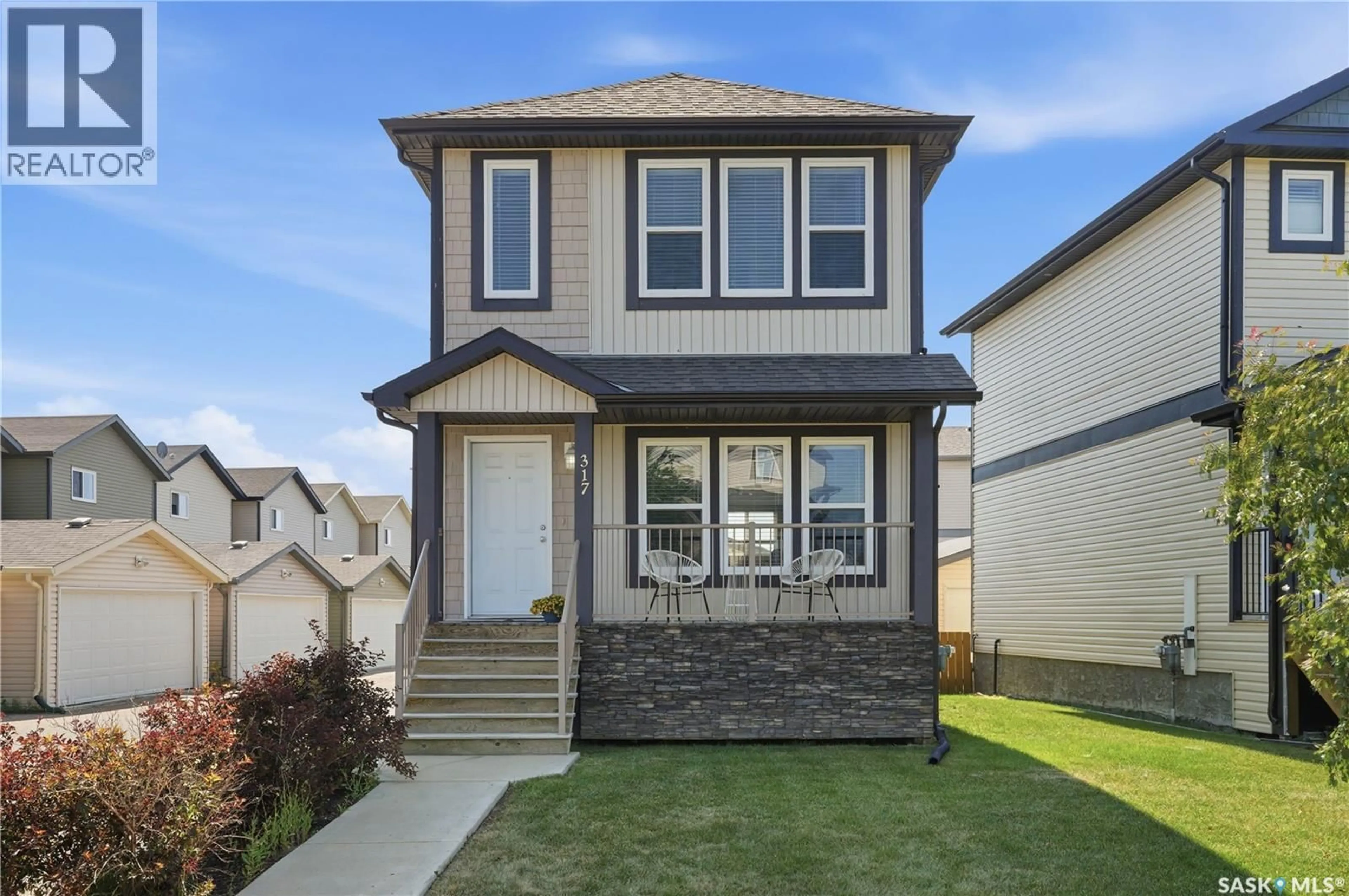 Home with vinyl exterior material, street for 317 315 HAMPTON CIRCLE, Saskatoon Saskatchewan S7R0J7