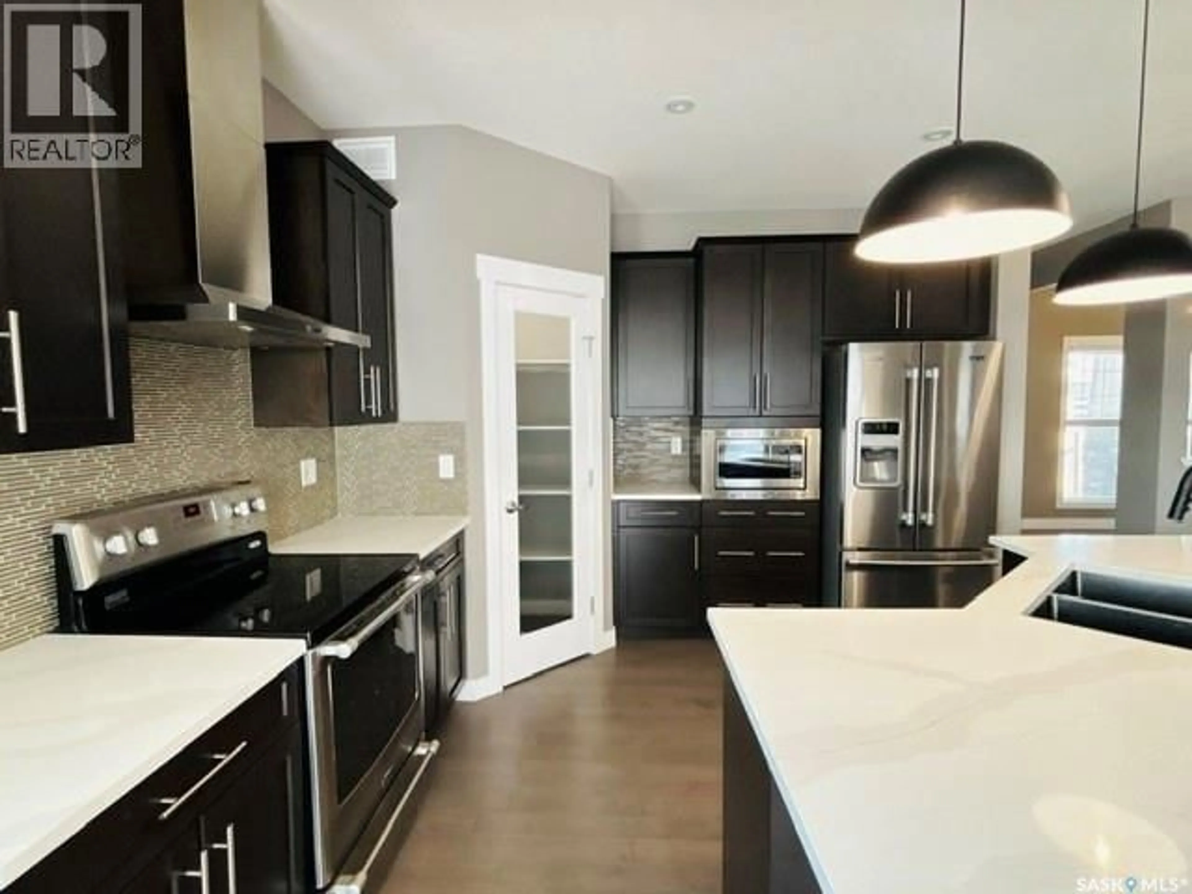 Open concept kitchen, unknown for 411 FLYNN LANE, Saskatoon Saskatchewan S7V0L1