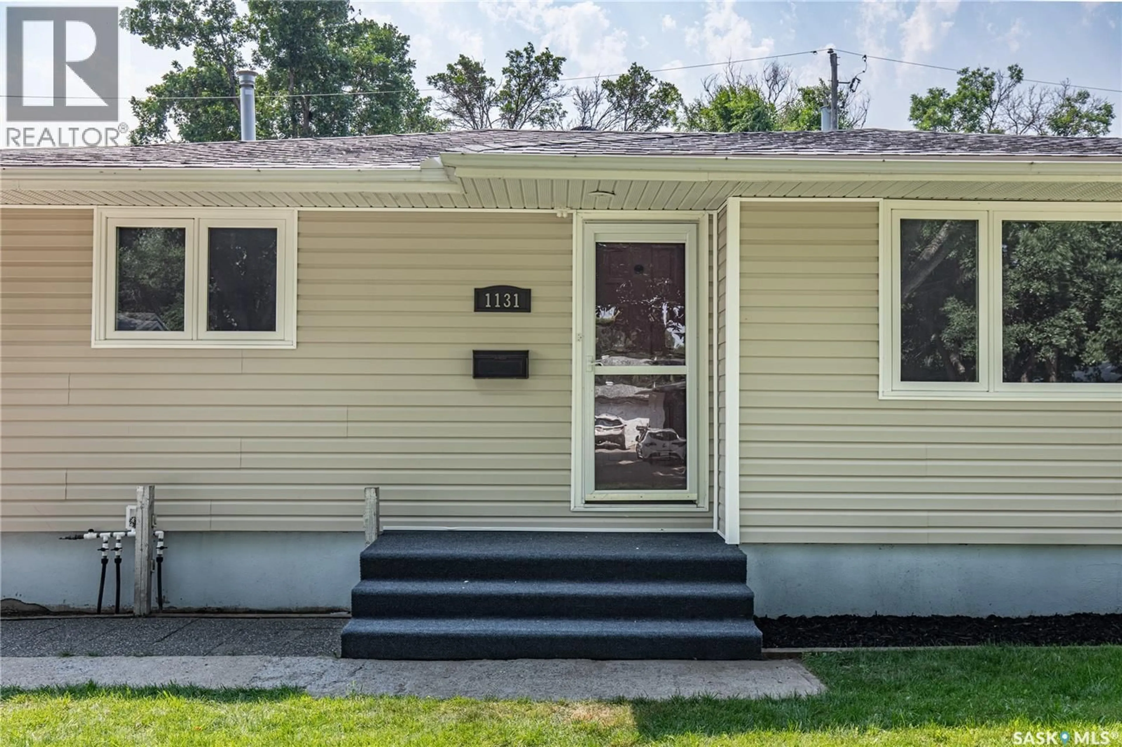 Home with vinyl exterior material, street for 1131 CURRIE CRESCENT, Moose Jaw Saskatchewan S6H5M7