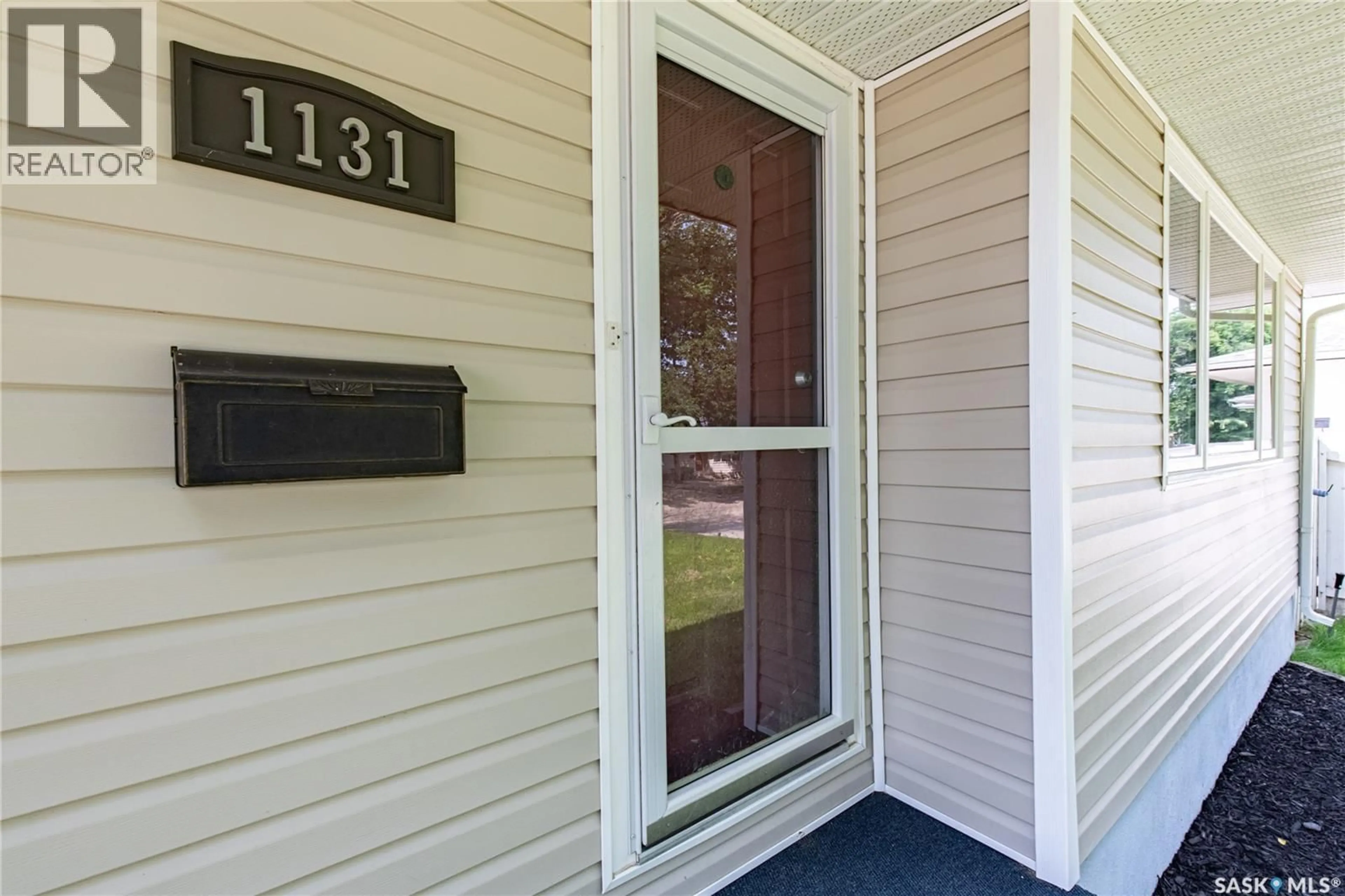 Home with vinyl exterior material, street for 1131 CURRIE CRESCENT, Moose Jaw Saskatchewan S6H5M7
