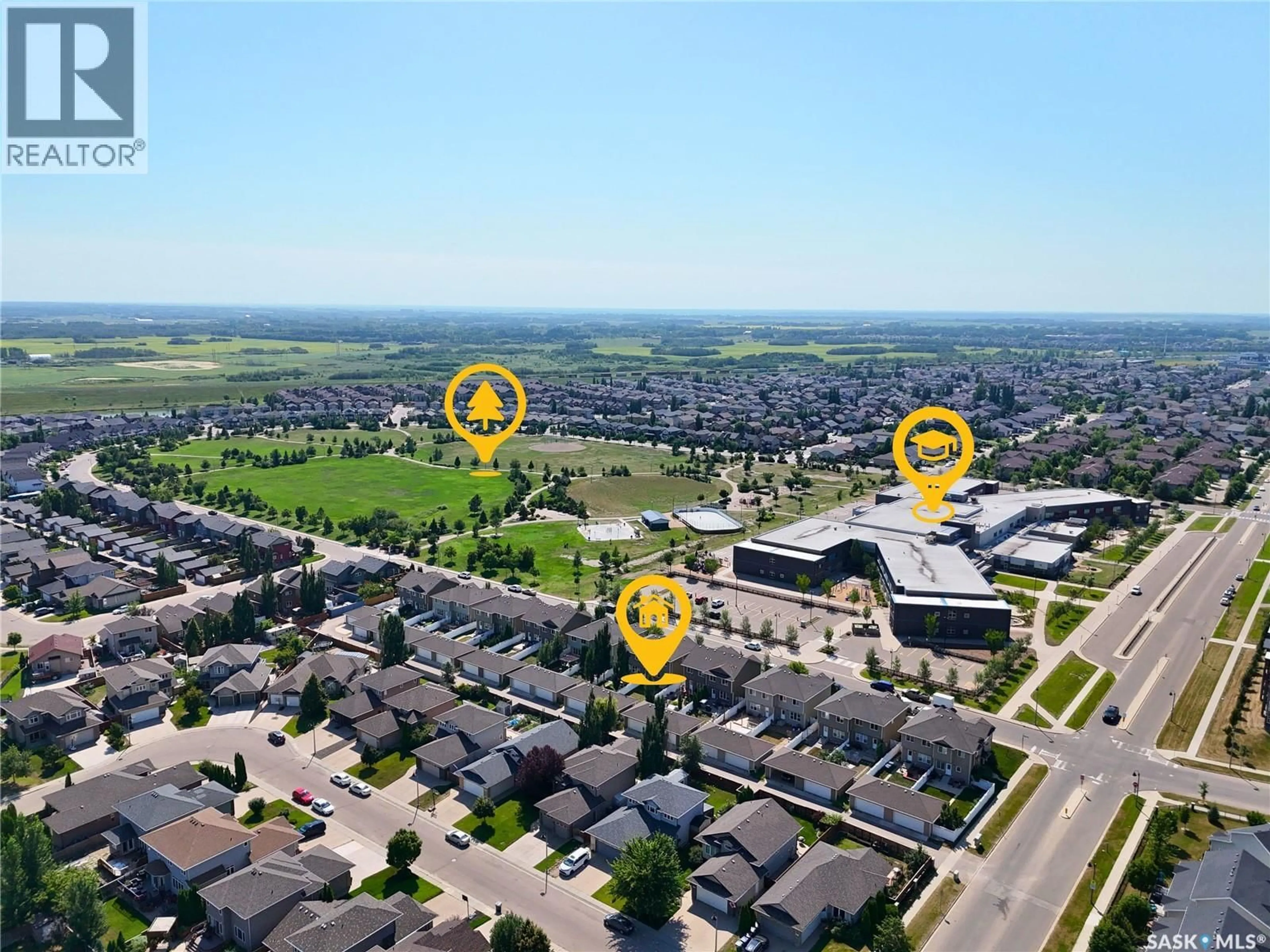 A pic from outside/outdoor area/front of a property/back of a property/a pic from drone, street for 924 STONEBRIDGE COMMON, Saskatoon Saskatchewan S7T0N2