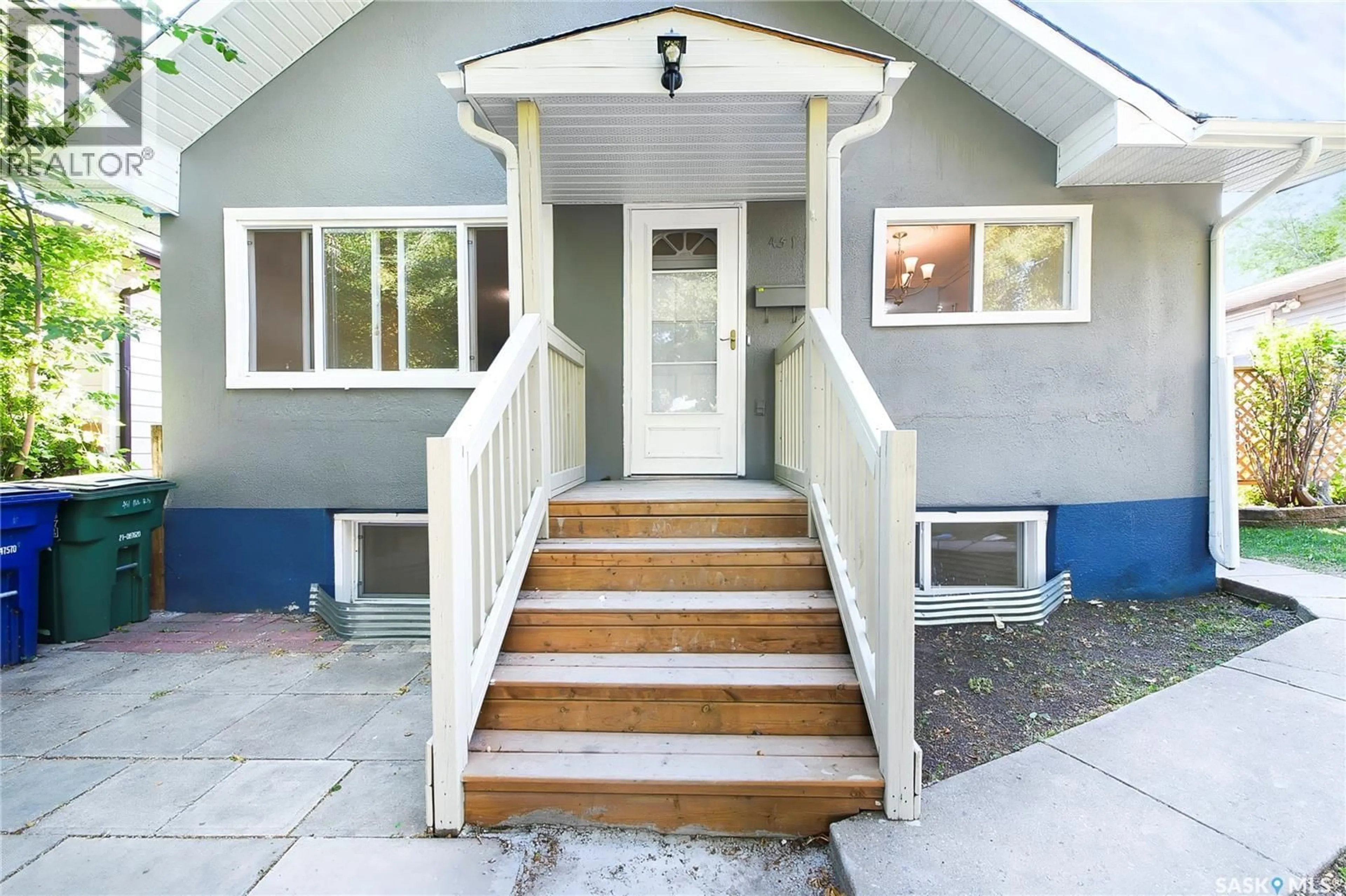 Home with vinyl exterior material, street for 451 R AVENUE S, Saskatoon Saskatchewan S7M2Z4