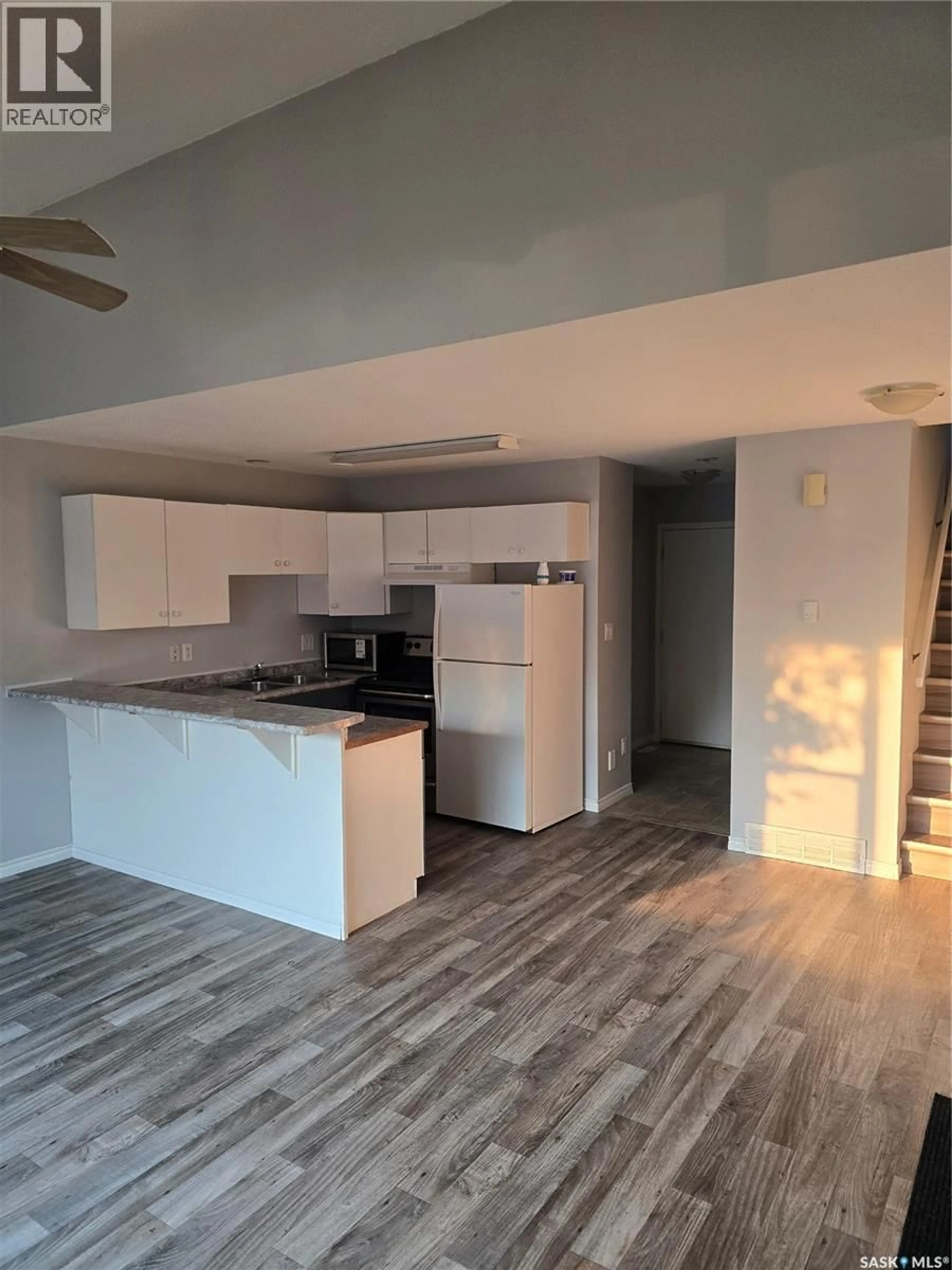 Open concept kitchen, wood/laminate floor for 1125 MCTAVISH STREET, Regina Saskatchewan S4T3V6
