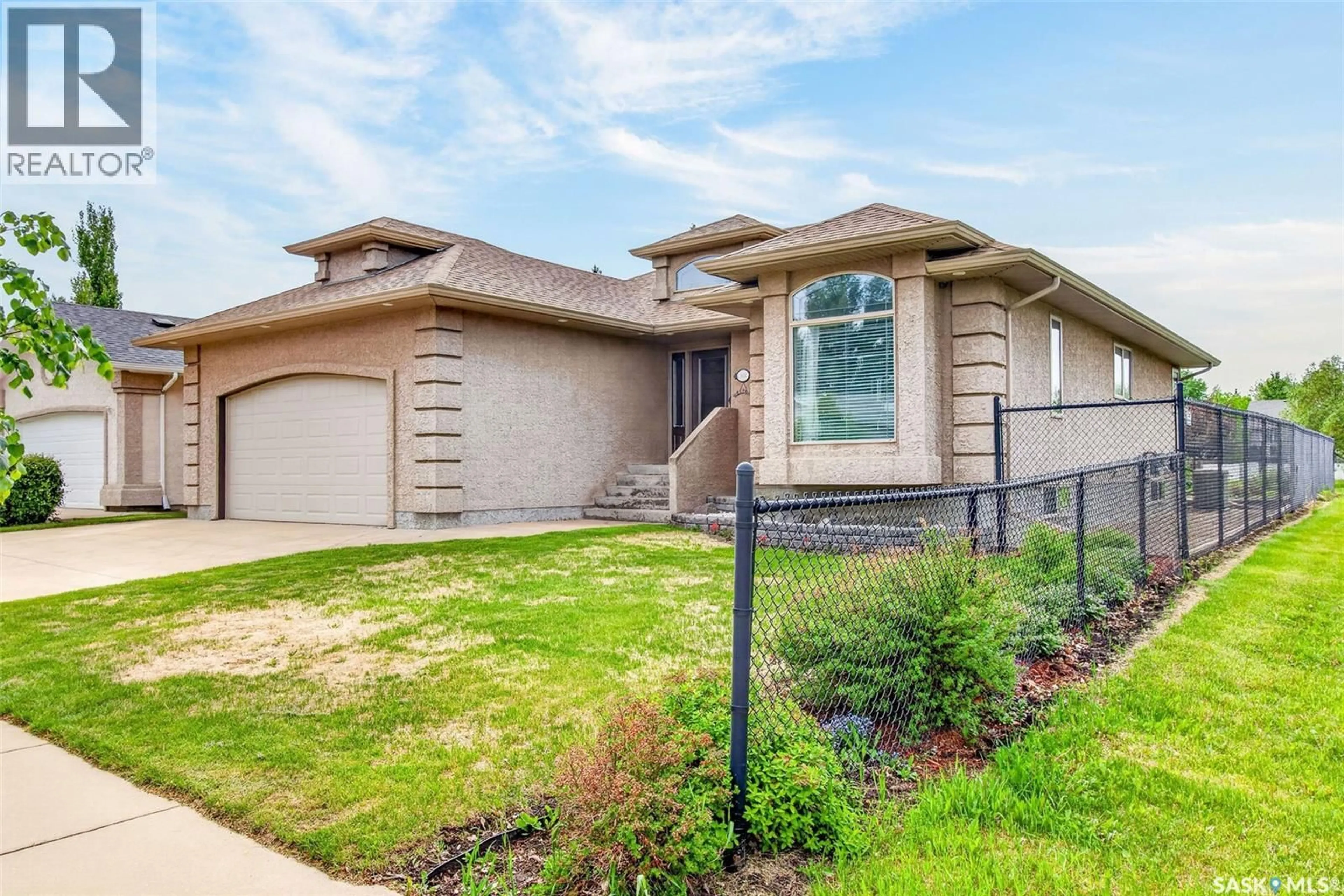 Home with brick exterior material, street for 1 TELFER BAY, Prince Albert Saskatchewan S6X1C4