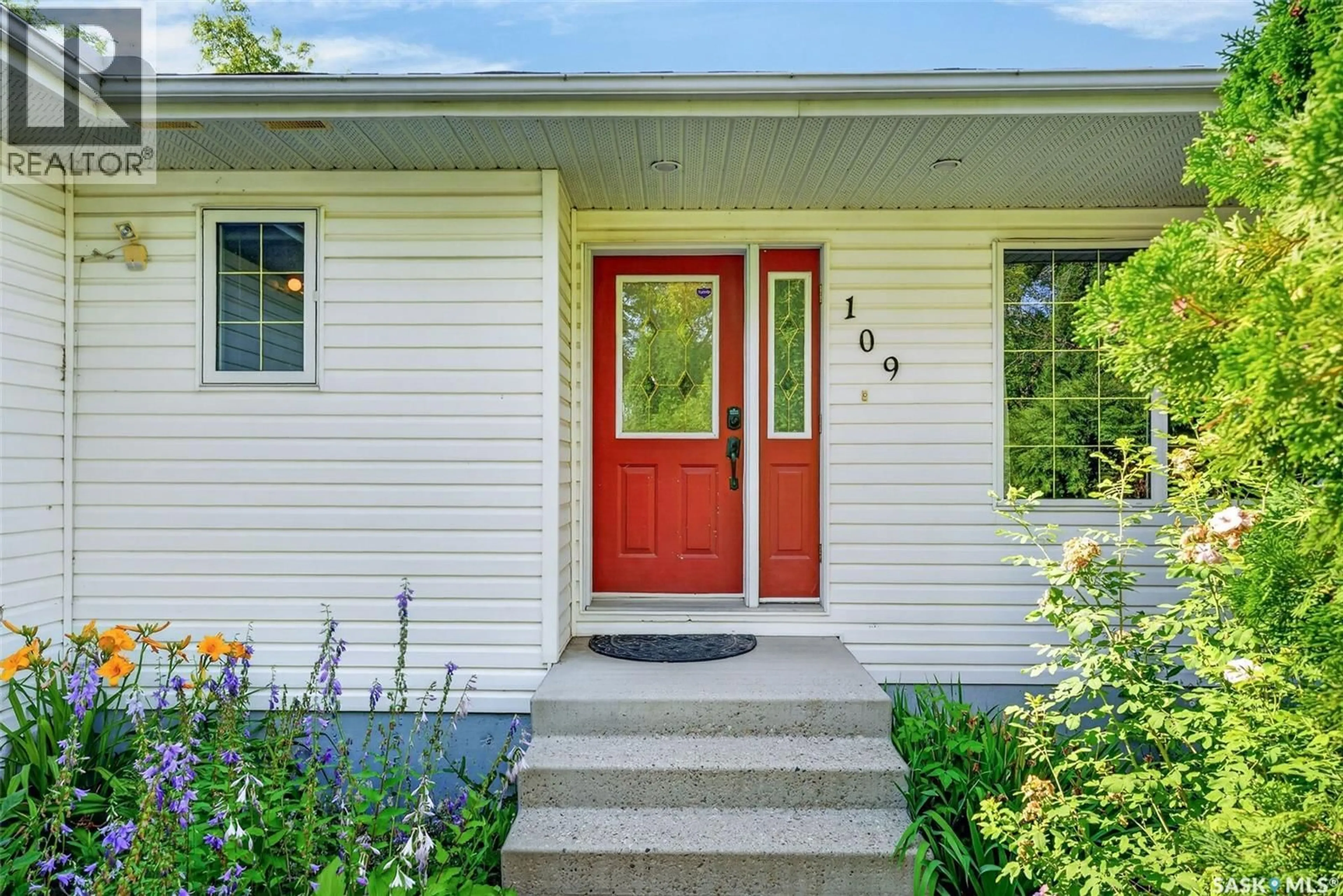 Home with vinyl exterior material, street for 109 1ST AVENUE, Vanscoy Saskatchewan S0L3J0