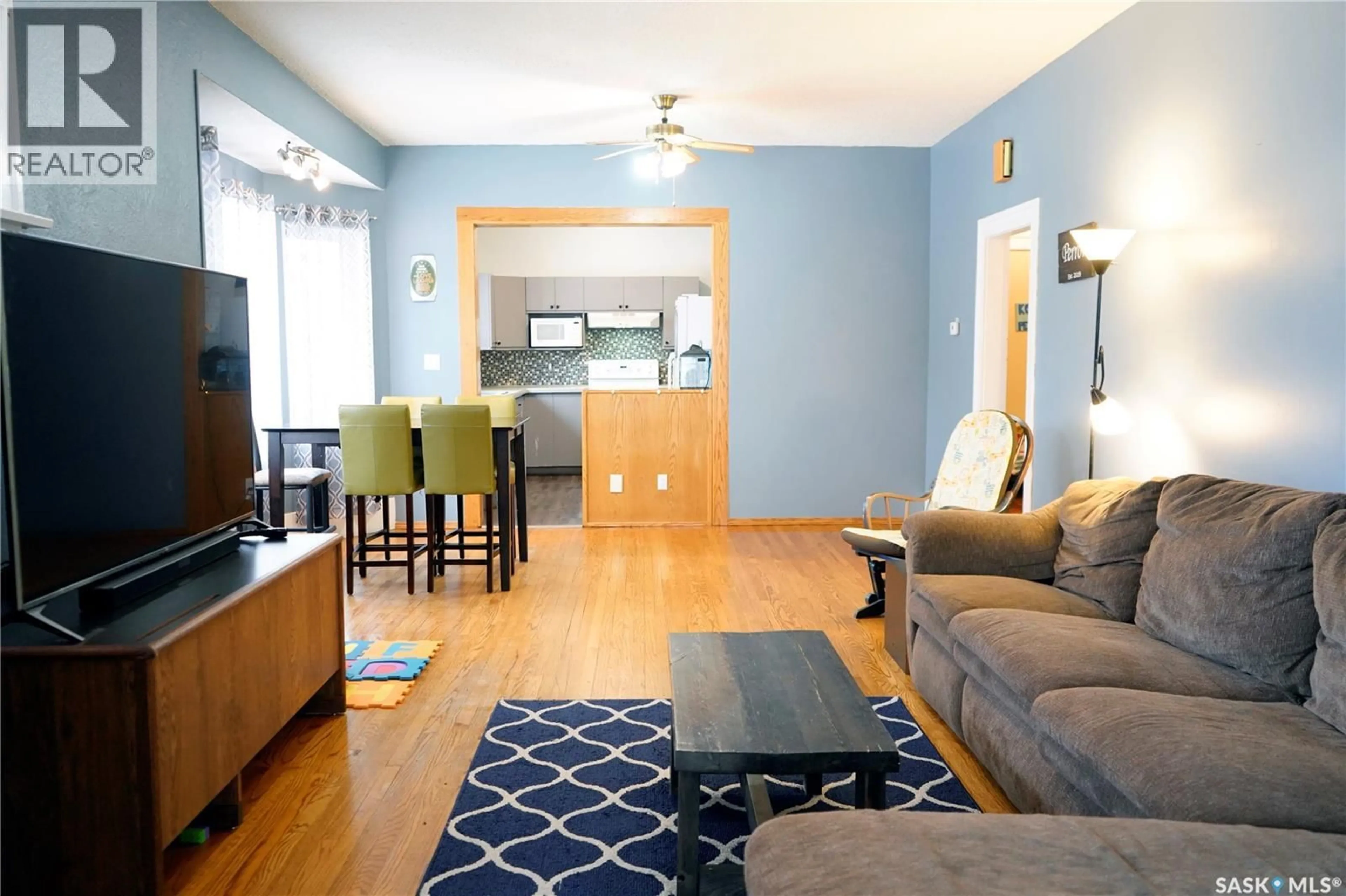 Living room with furniture, wood/laminate floor for 394 2ND STREET, Shaunavon Saskatchewan S0N2M0