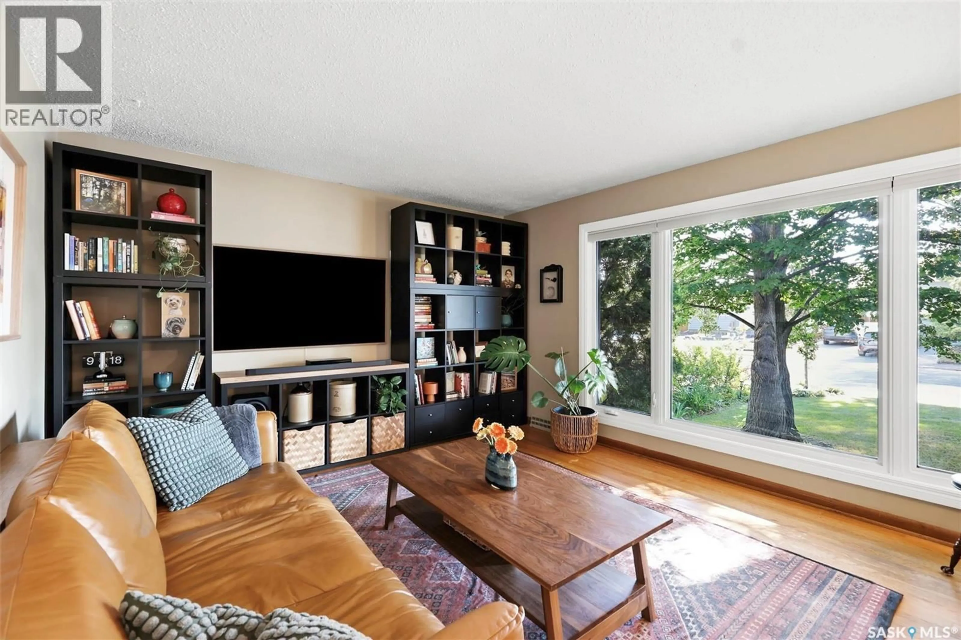 Living room with furniture, wood/laminate floor for 2002 PARK AVENUE, Saskatoon Saskatchewan S7J2B9