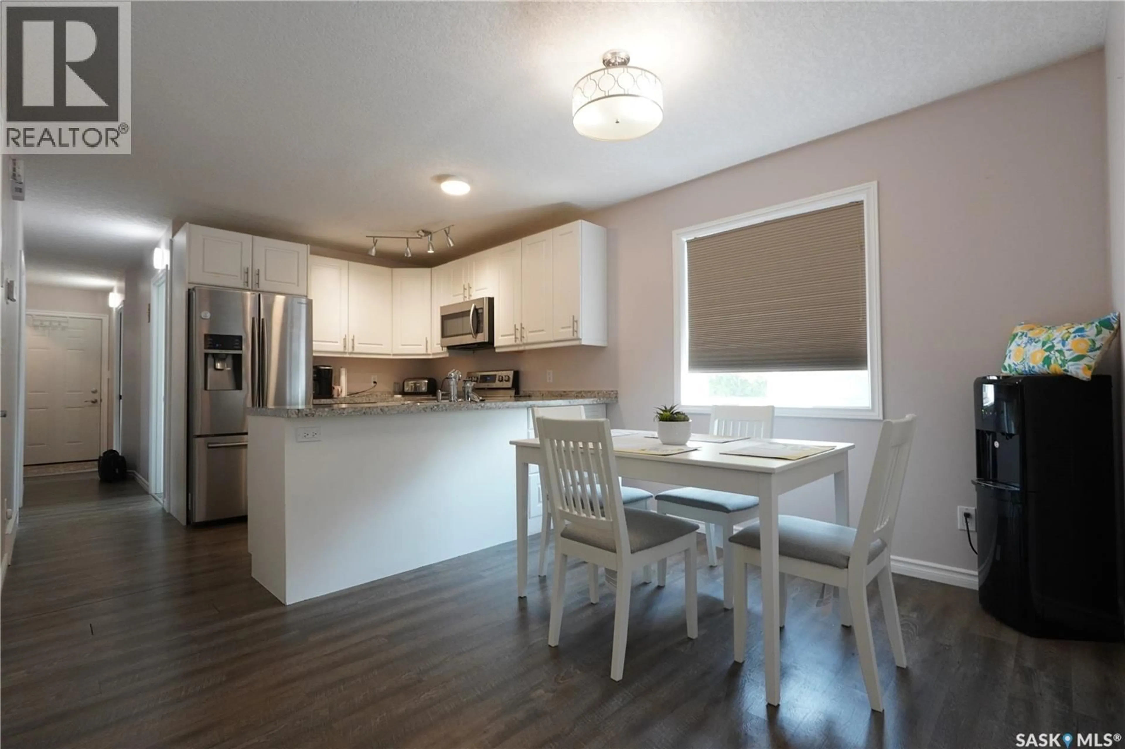 Open concept kitchen, wood/laminate floor for 5602 DEWDNEY AVENUE, Regina Saskatchewan S4T1C7