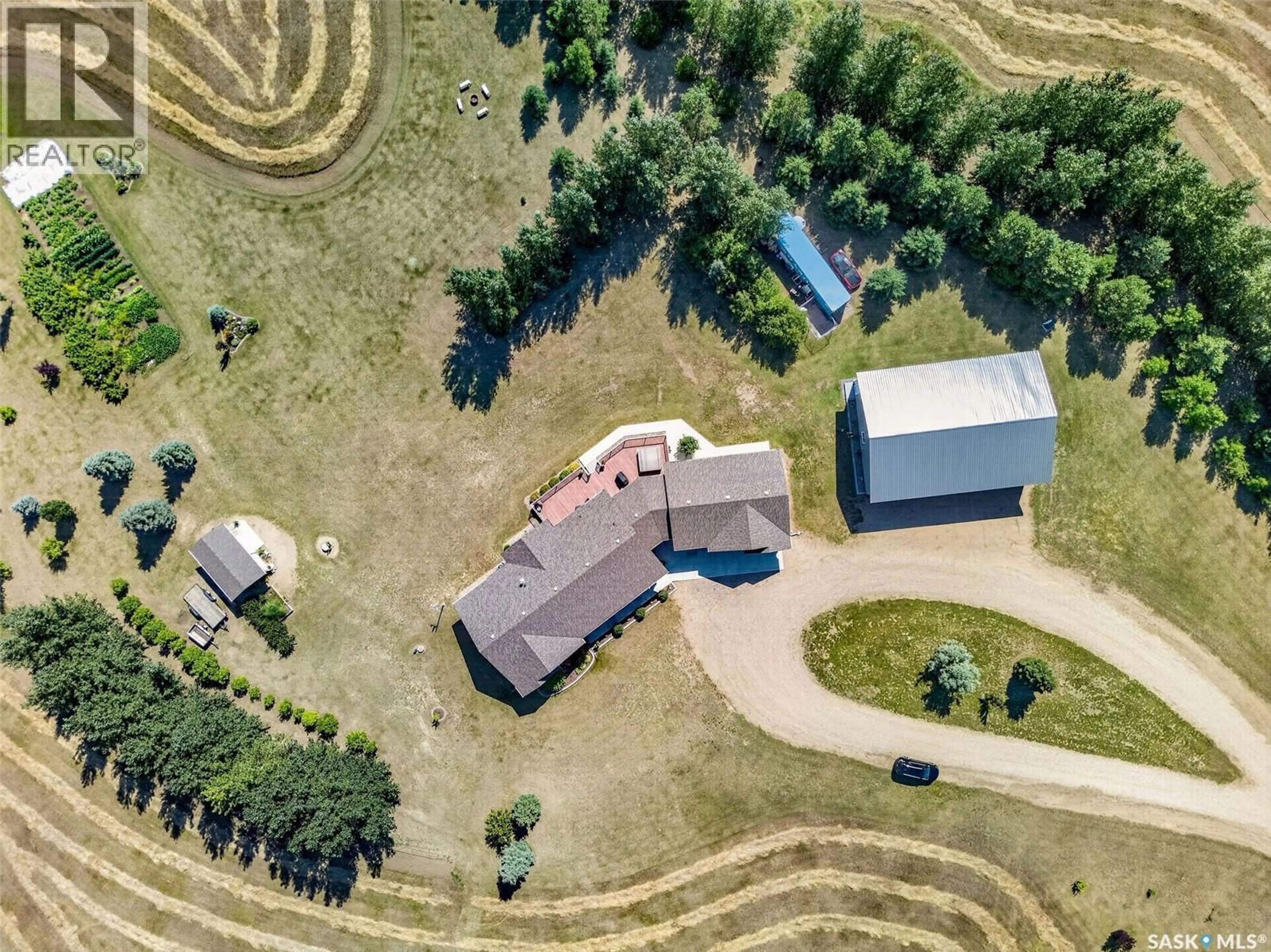 A pic from outside/outdoor area/front of a property/back of a property/a pic from drone, unknown for Acreage - PIKE LAKE RD, Vanscoy Rm No. 345 Saskatchewan S0L3J0