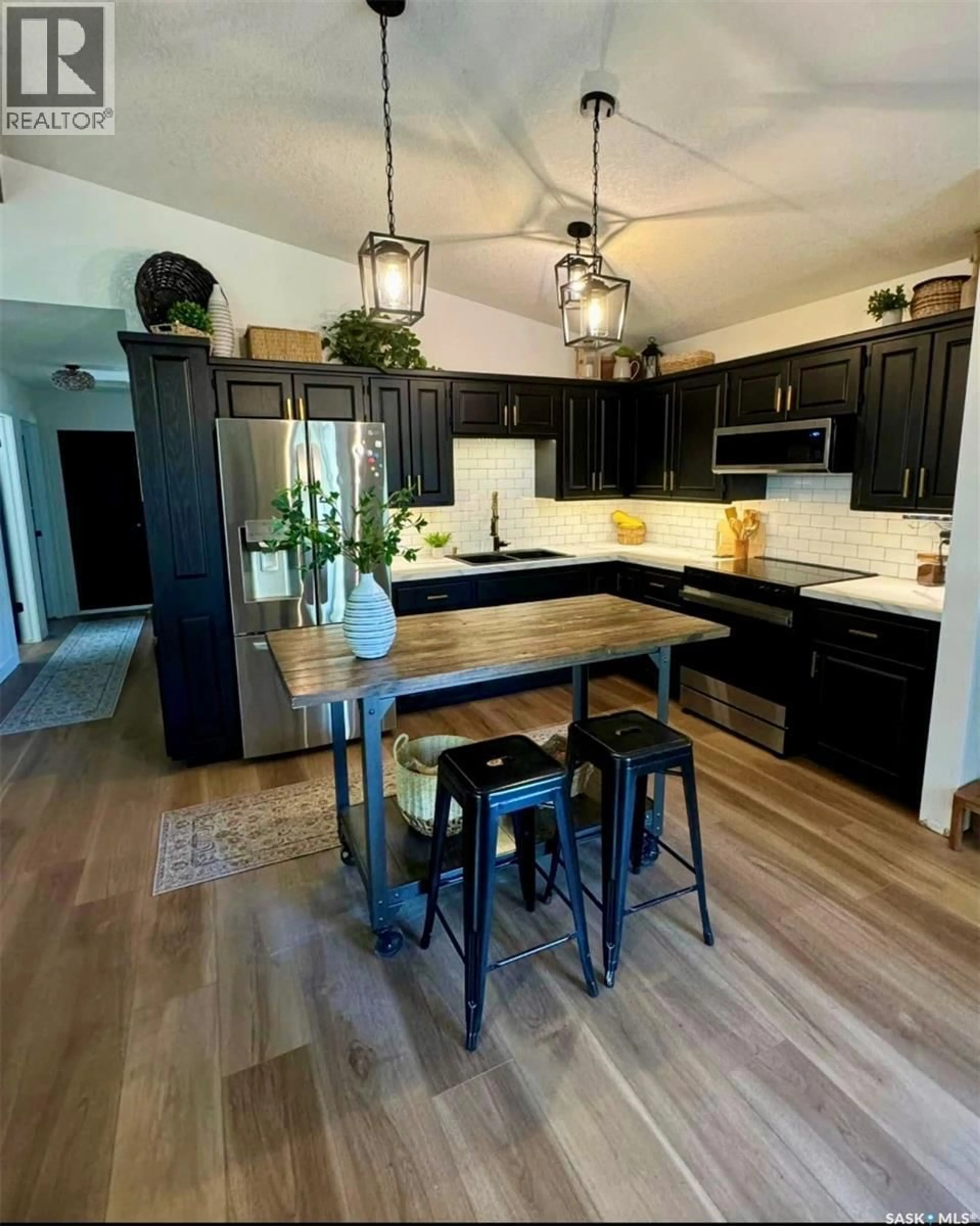 Open concept kitchen, wood/laminate floor for 183 POPLAR LANE, Wee Too Beach Saskatchewan S0G1C0