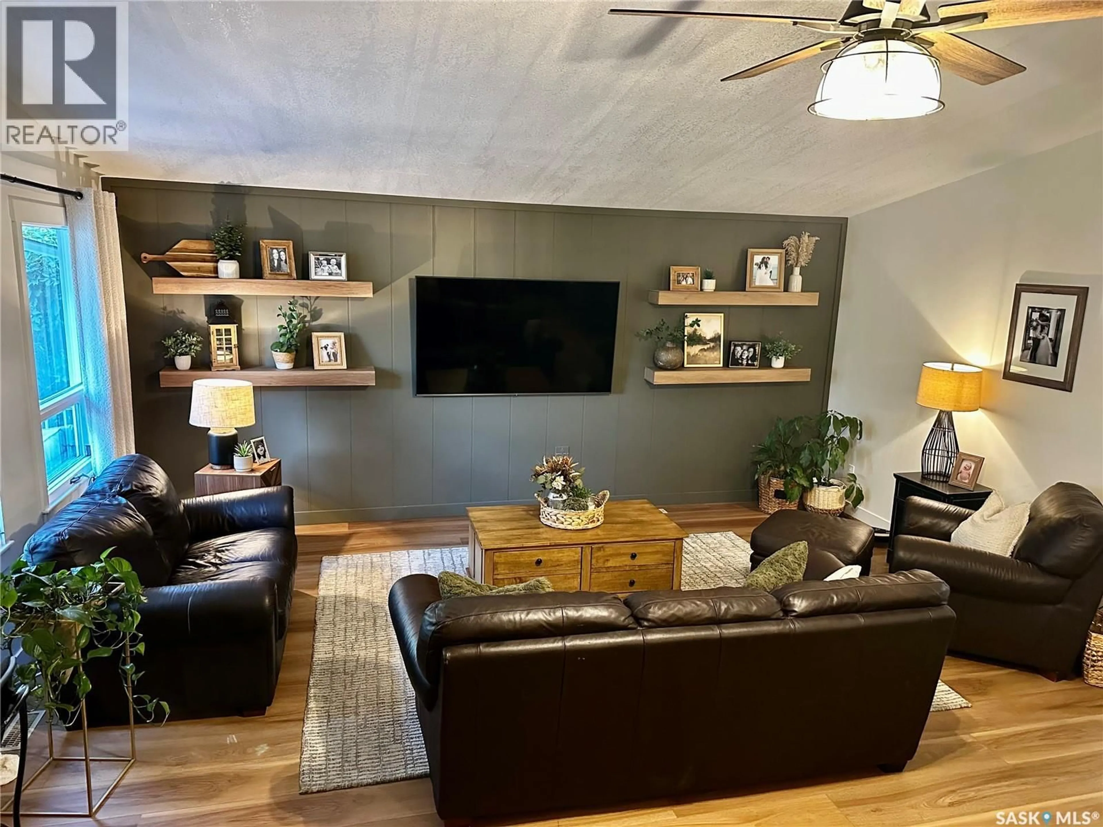 Living room with furniture, wood/laminate floor for 183 POPLAR LANE, Wee Too Beach Saskatchewan S0G1C0