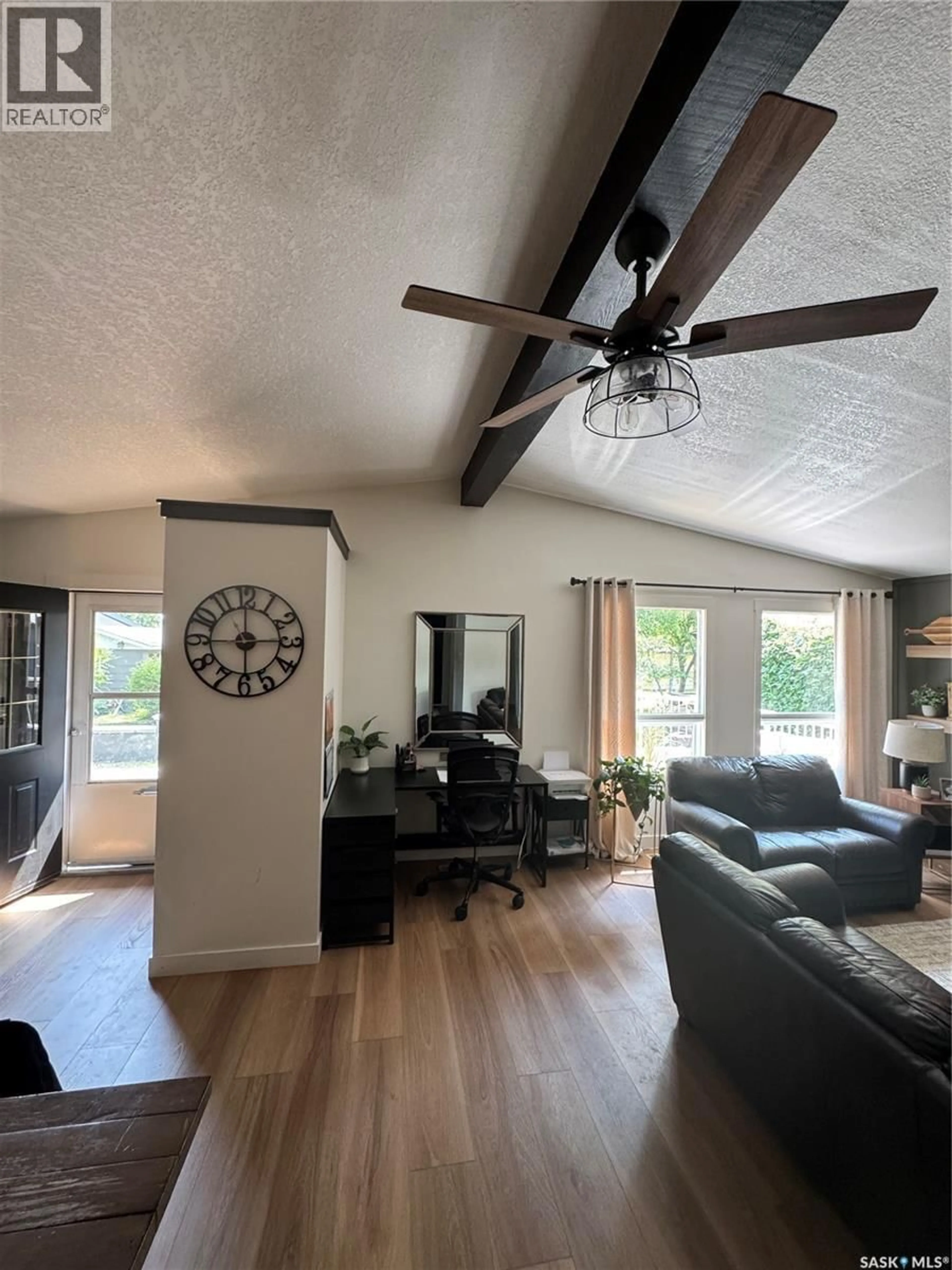 Living room with furniture, wood/laminate floor for 183 POPLAR LANE, Wee Too Beach Saskatchewan S0G1C0