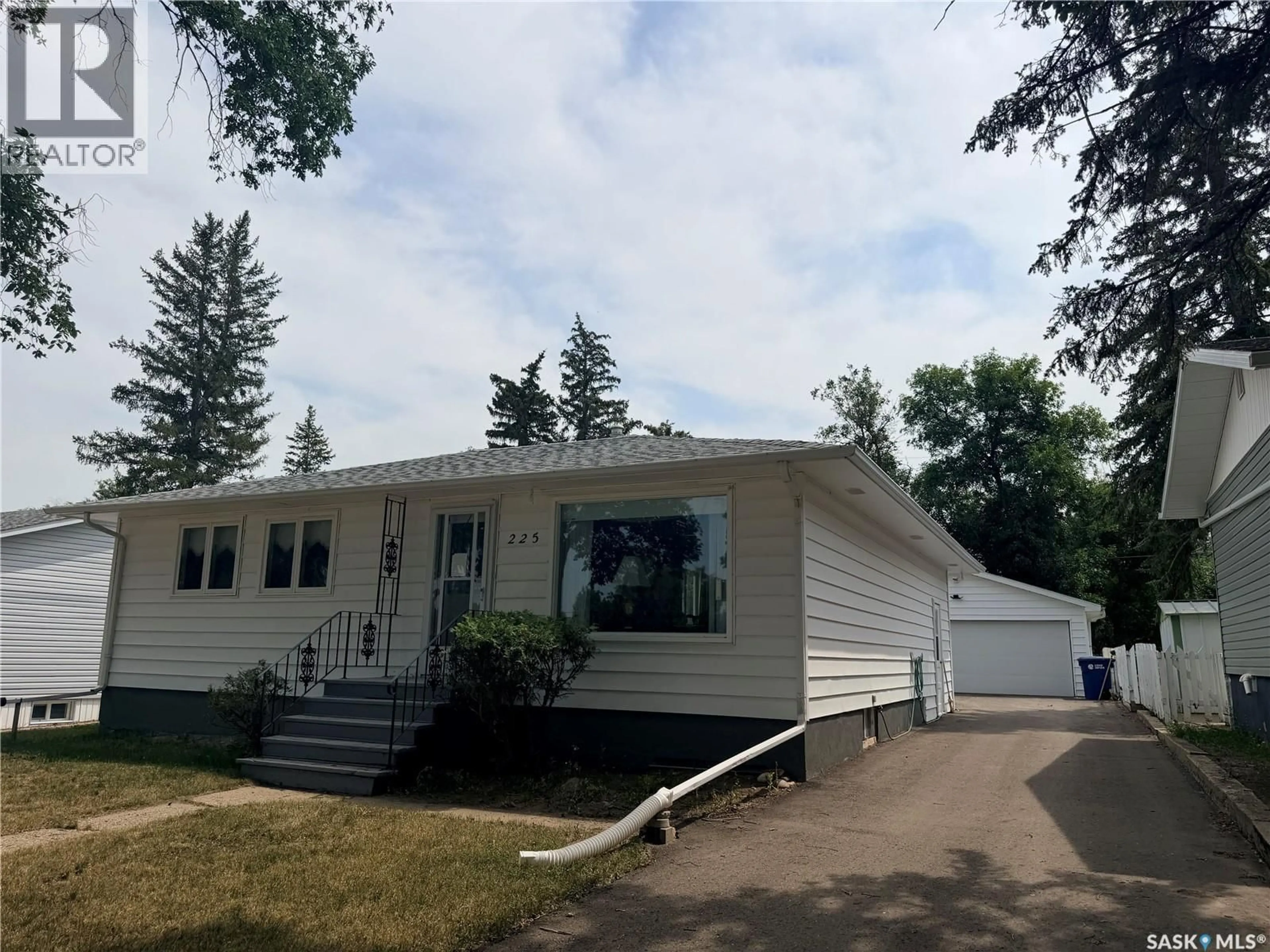 Home with vinyl exterior material, street for 225 DOMINION ROAD, Assiniboia Saskatchewan S0H0B0