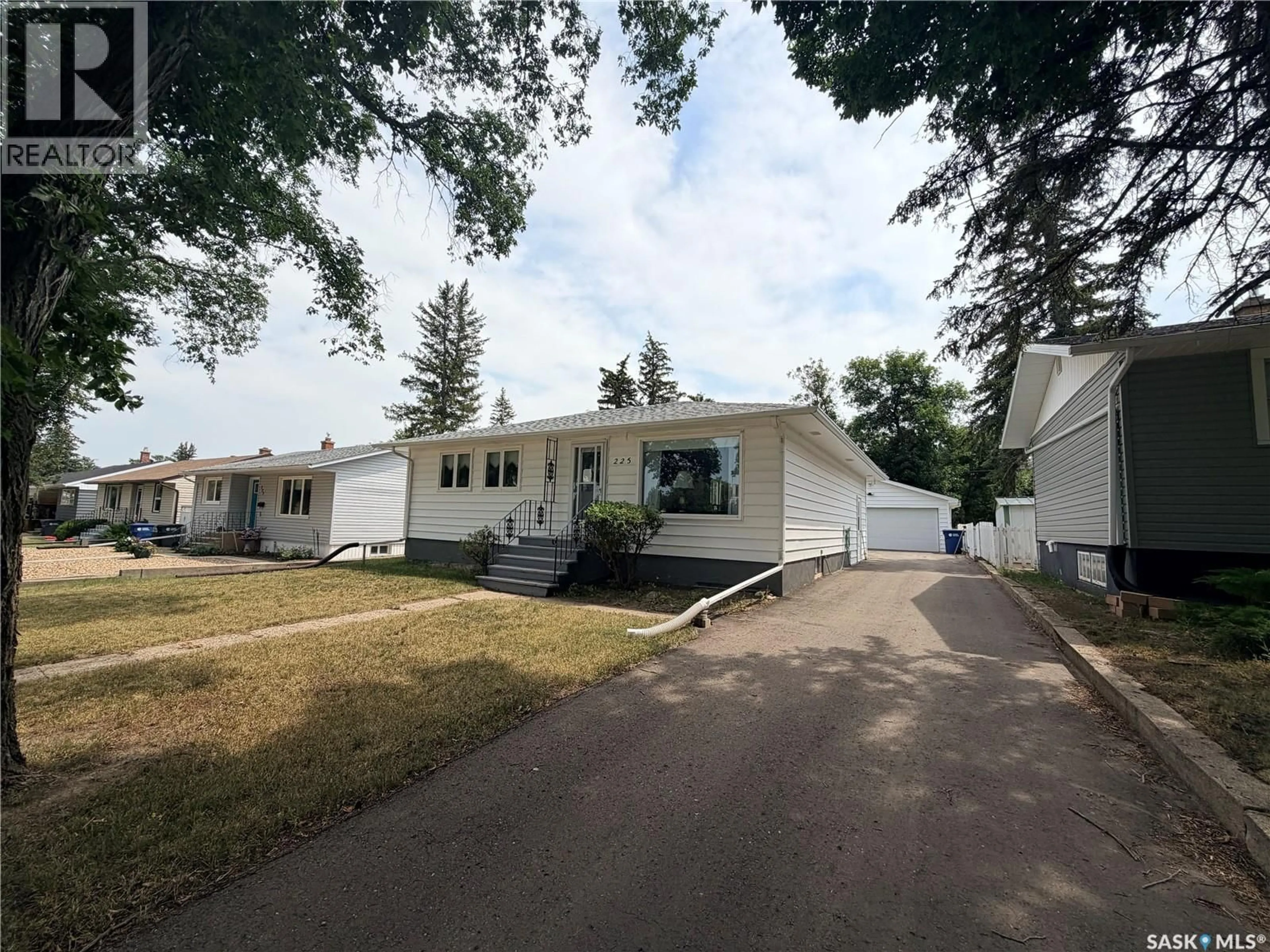 Home with vinyl exterior material, street for 225 DOMINION ROAD, Assiniboia Saskatchewan S0H0B0