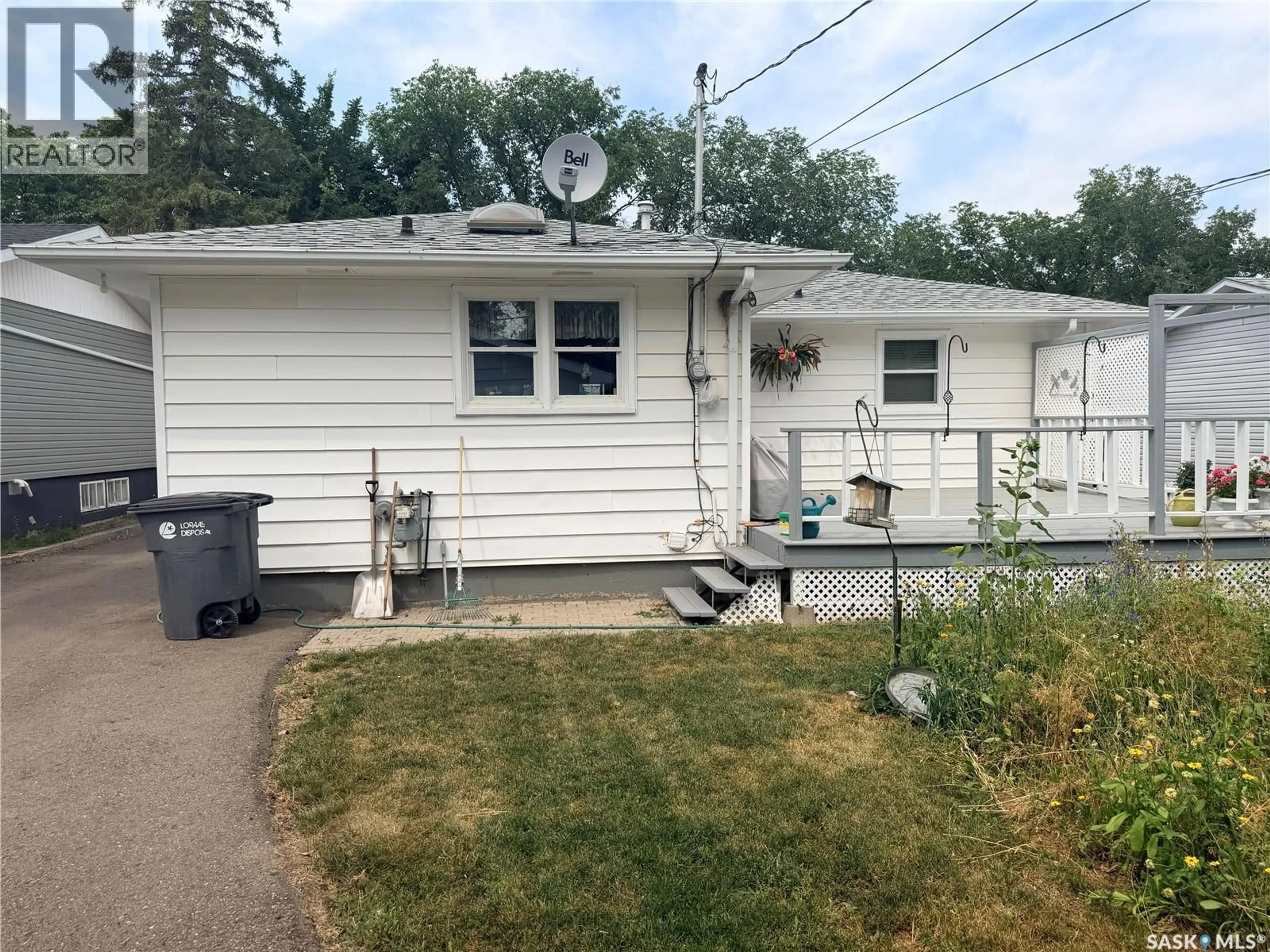 Home with vinyl exterior material, street for 225 DOMINION ROAD, Assiniboia Saskatchewan S0H0B0