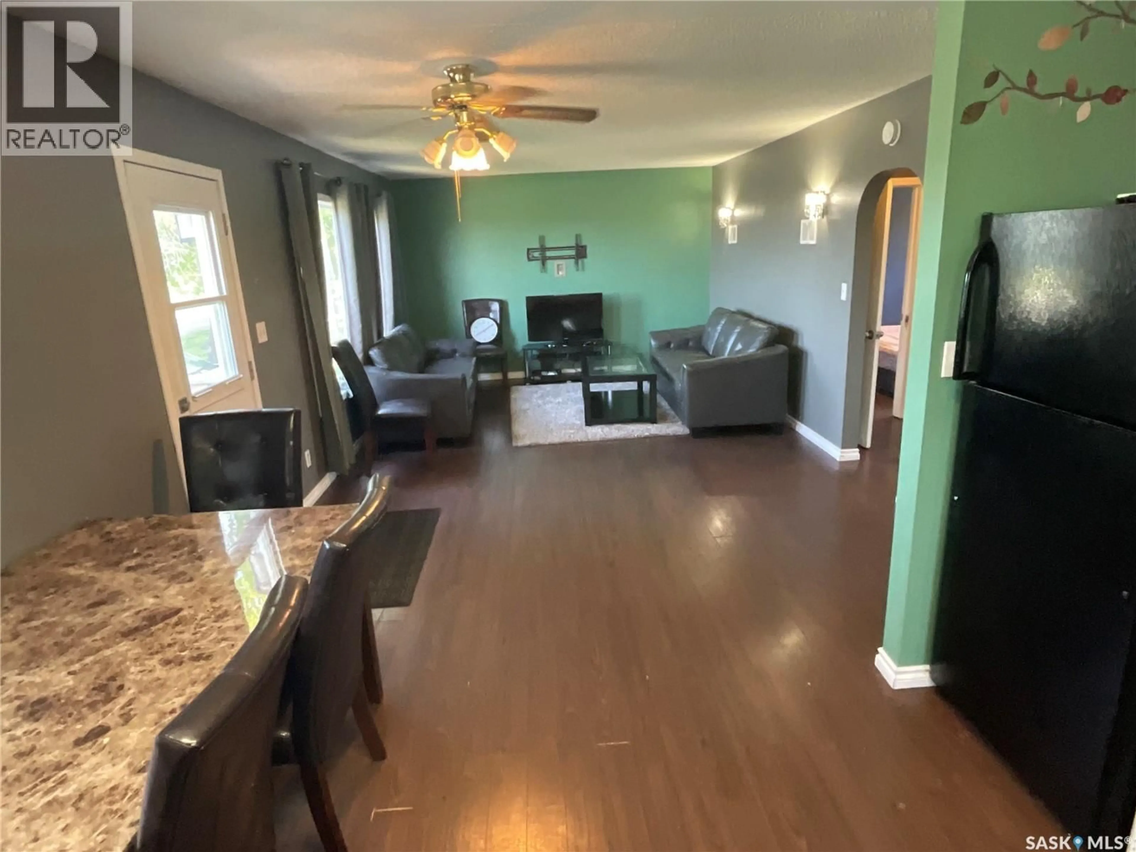Living room with furniture, wood/laminate floor for 217 3RD STREET, Wakaw Saskatchewan S0K4P0