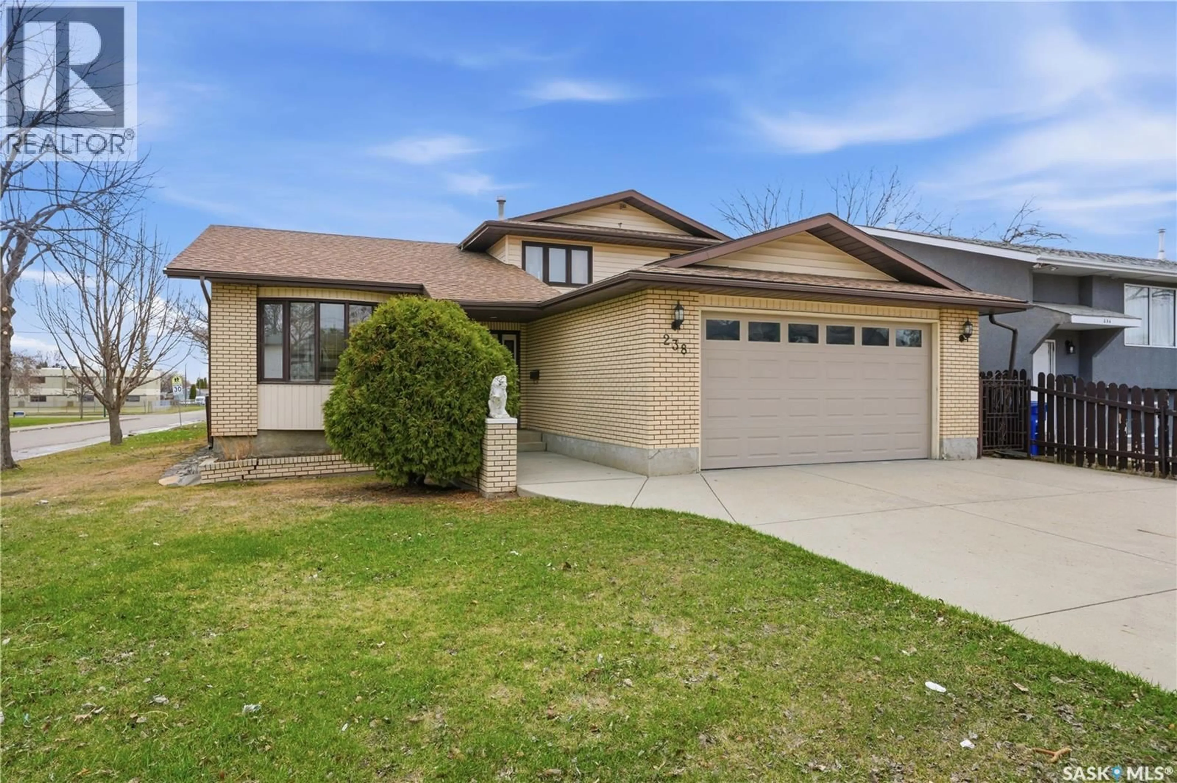 Home with vinyl exterior material, street for 238 S AVENUE N, Saskatoon Saskatchewan S7L2Z8