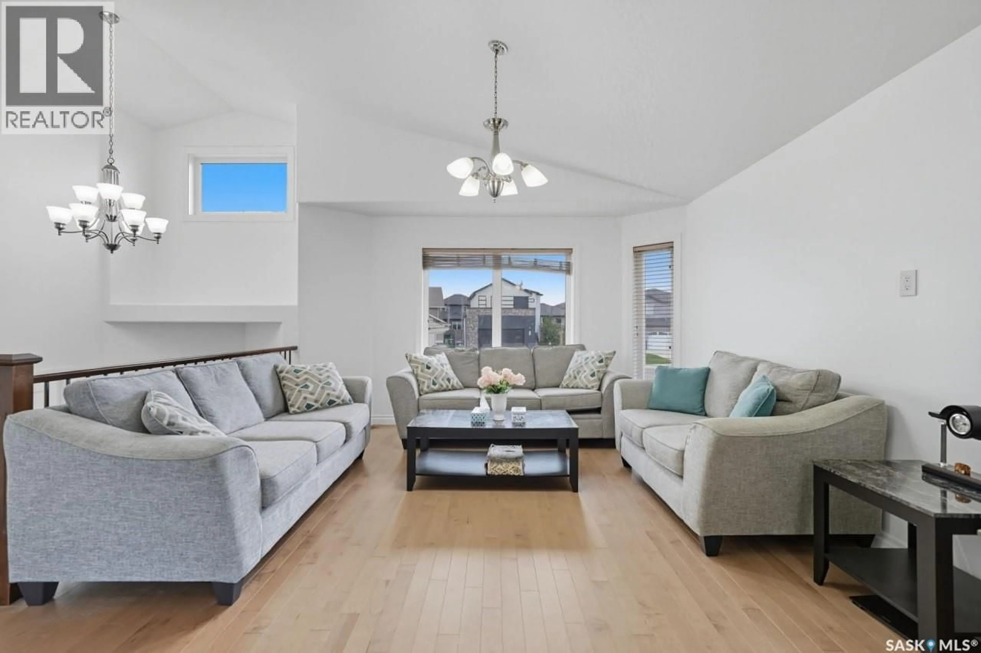 Living room with furniture, wood/laminate floor for 455 HASTINGS CRESCENT, Saskatoon Saskatchewan S7V0C8