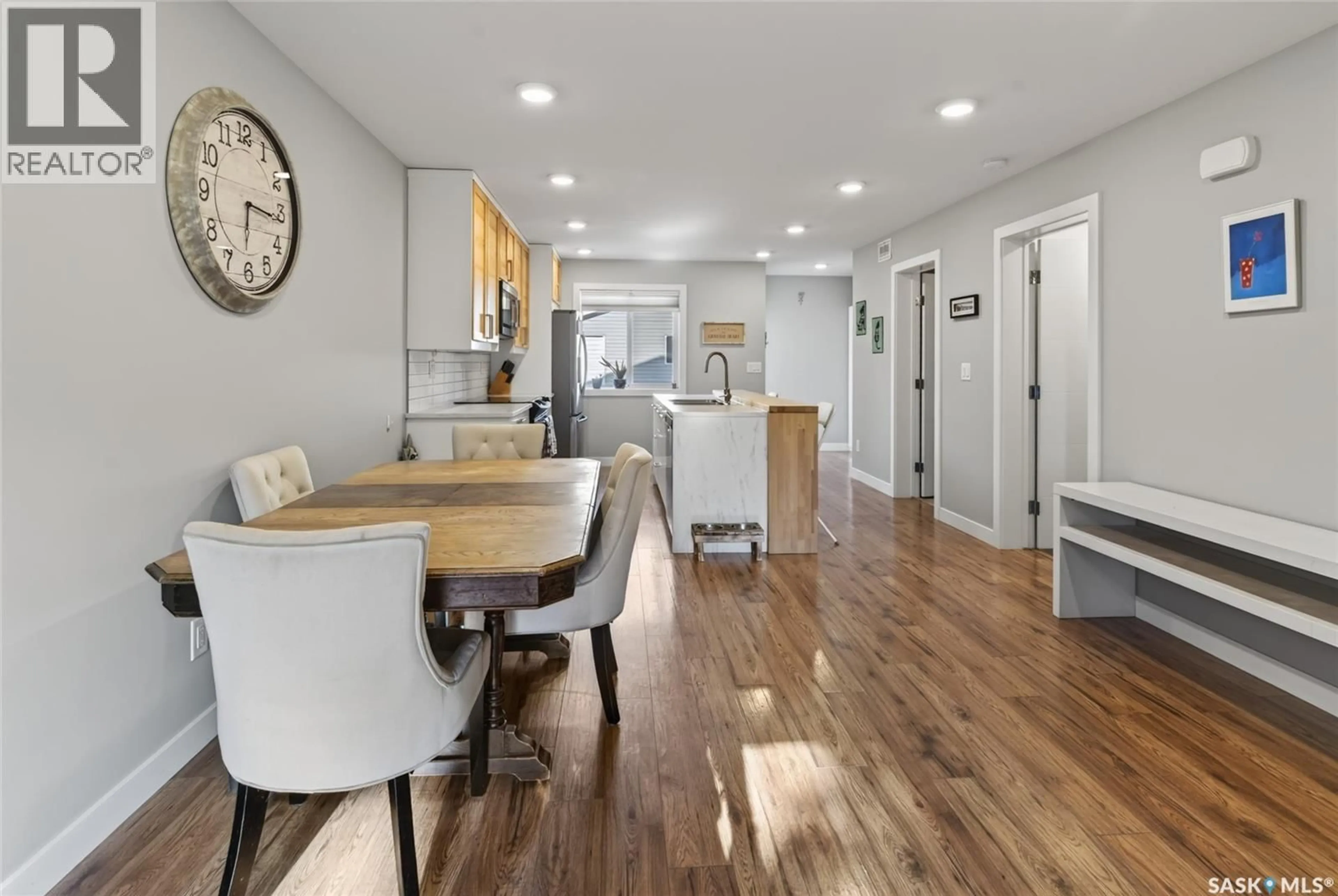 Open concept kitchen, wood/laminate floor for 514 K AVENUE, Saskatoon Saskatchewan S7L2M7