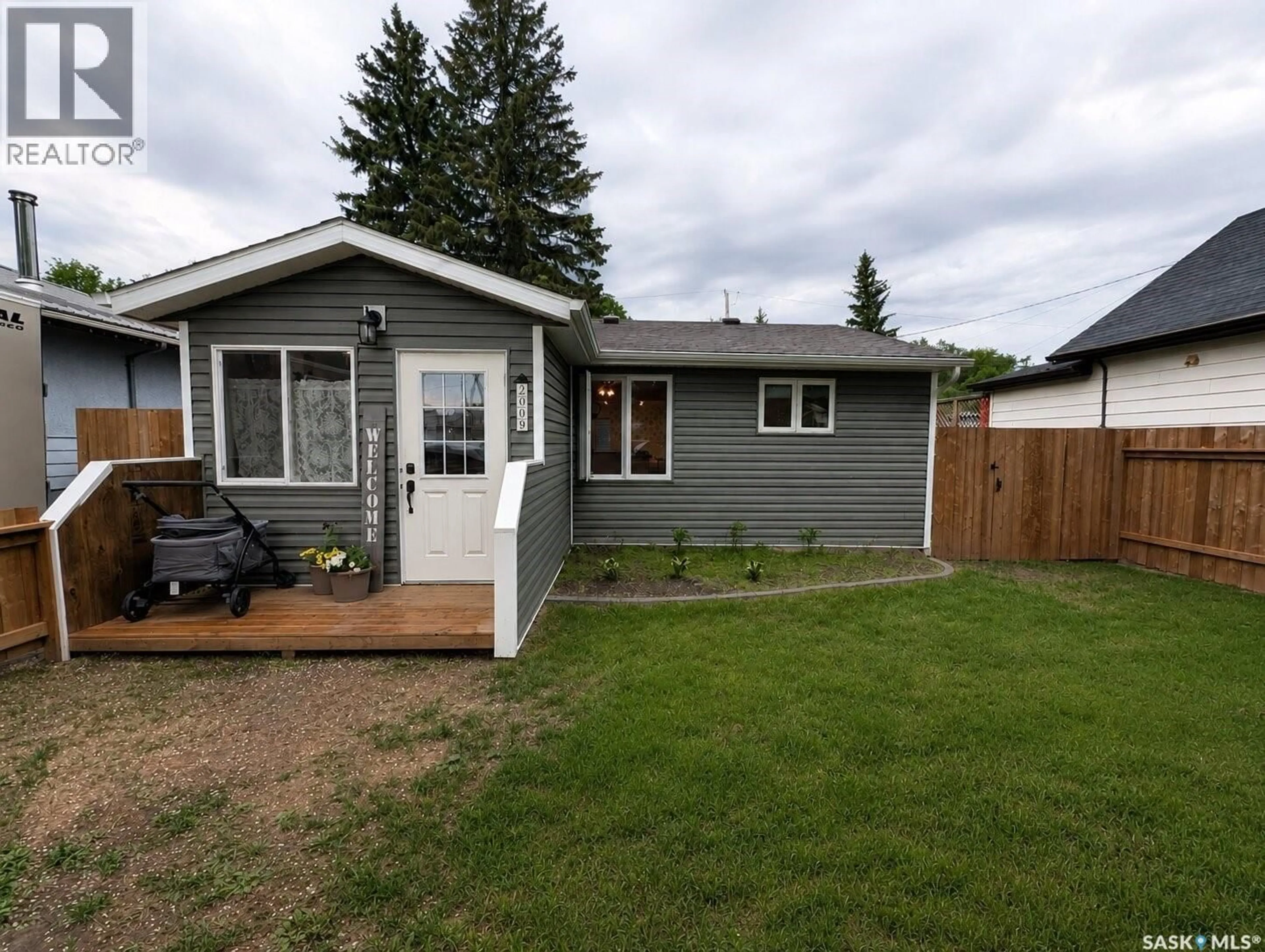 Home with vinyl exterior material, street for 2009 7TH STREET, Rosthern Saskatchewan S0K3R0